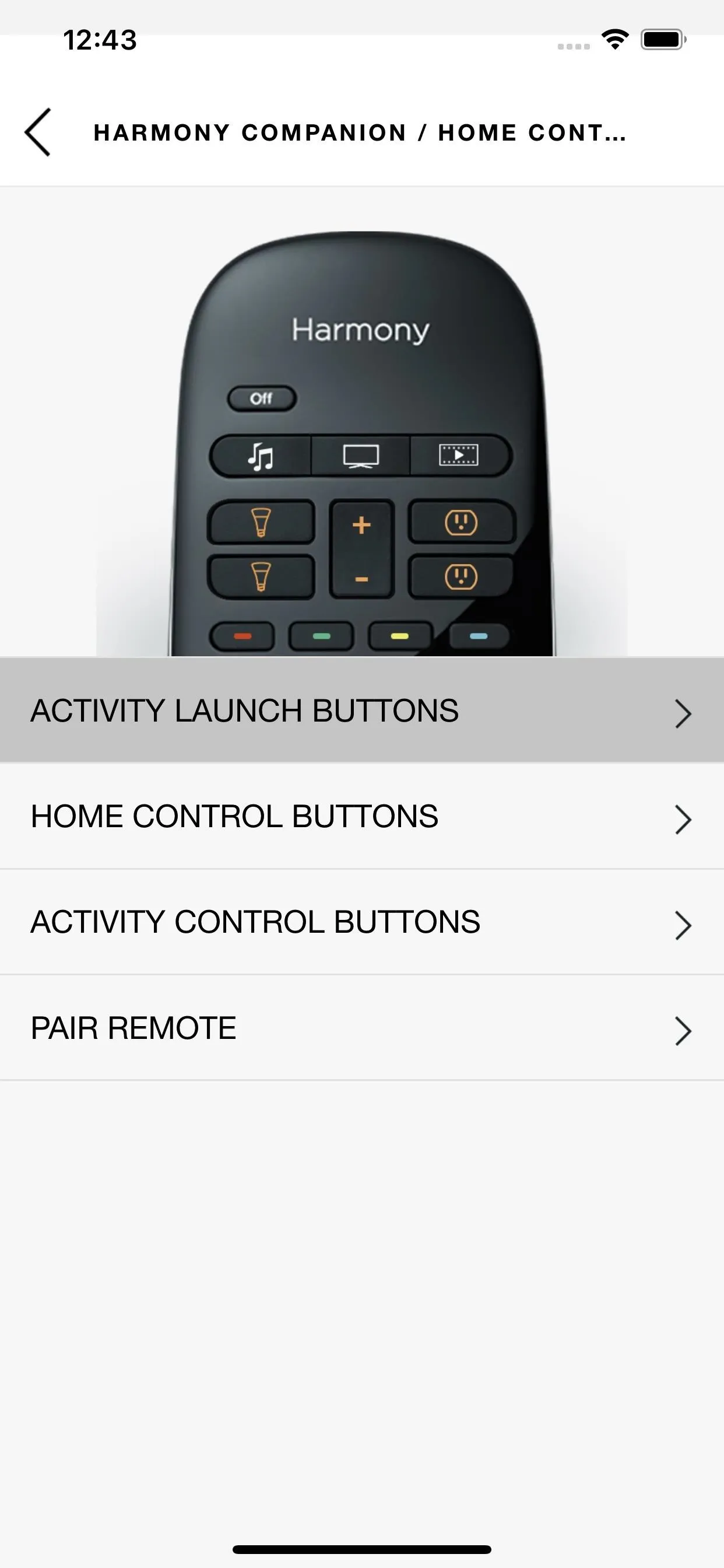 Remote control with labeled buttons for activity launch, home control, and pairing.