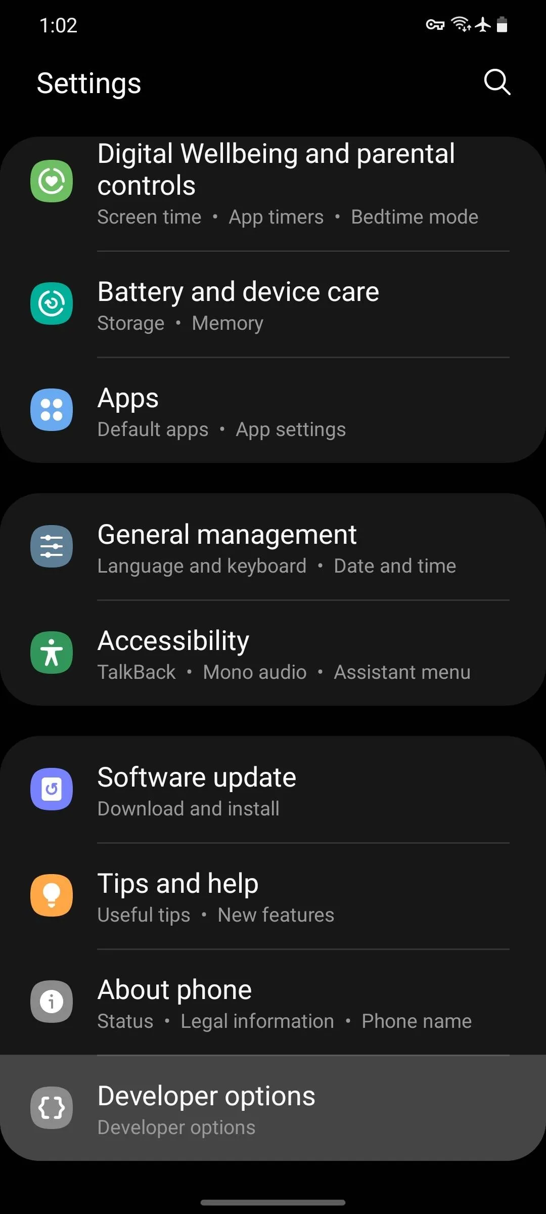 Settings menu on a smartphone displaying various options including account management, accessibility, software updates, and developer options.