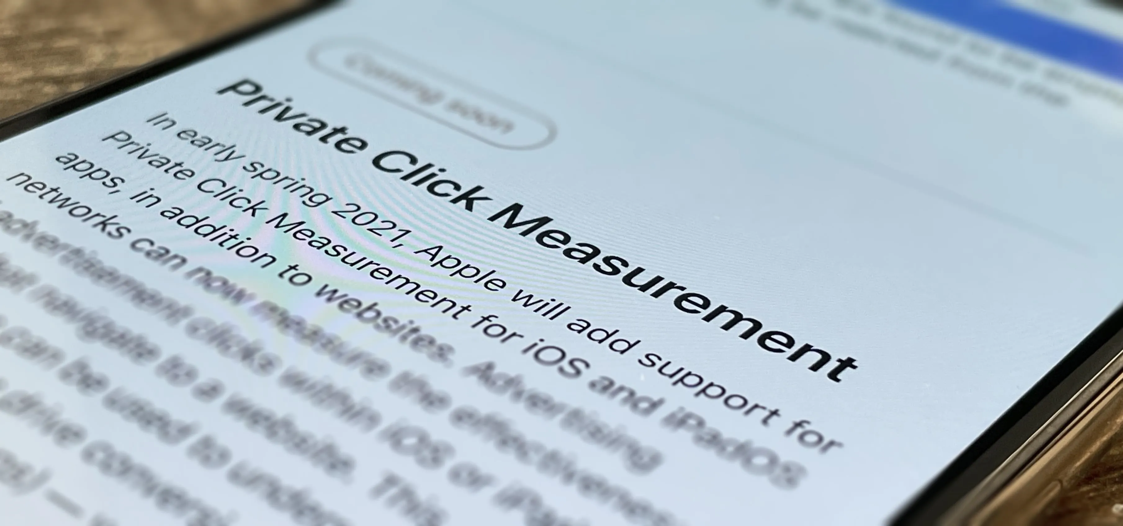 Private Click Measurement announcement on a smartphone screen.