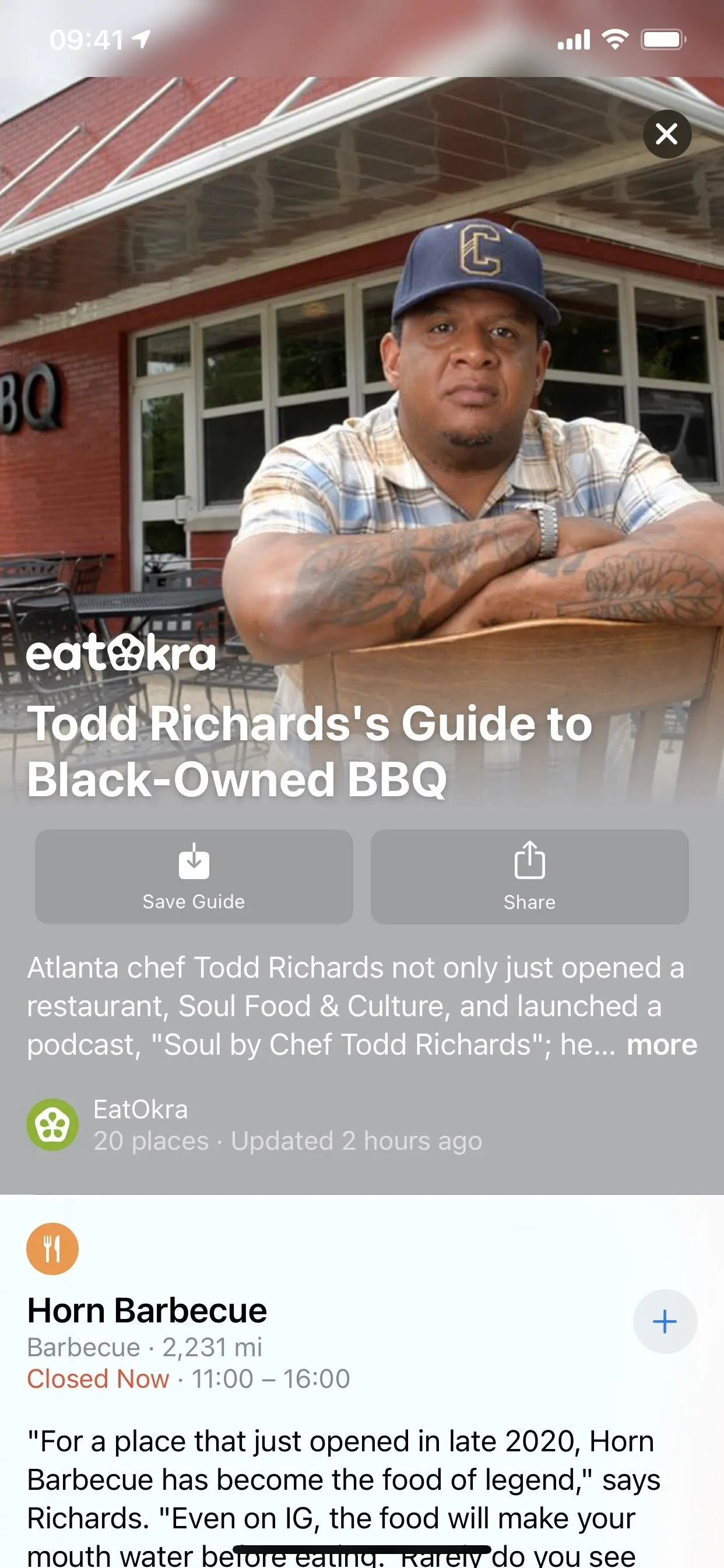 Barbecue restaurant exterior with a smiling chef in front.