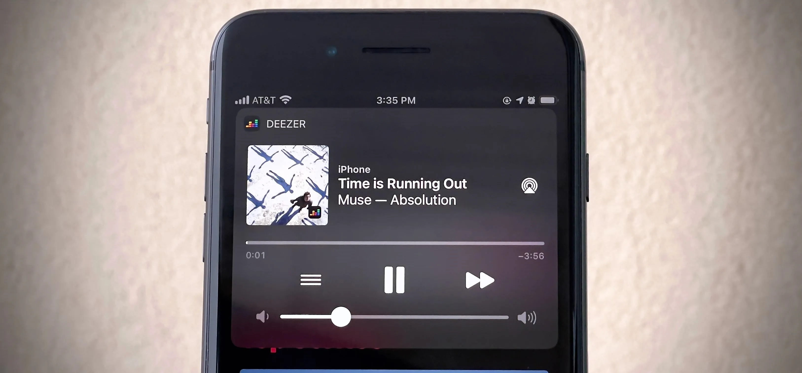 Music player interface showing the song "Time is Running Out" by Muse.