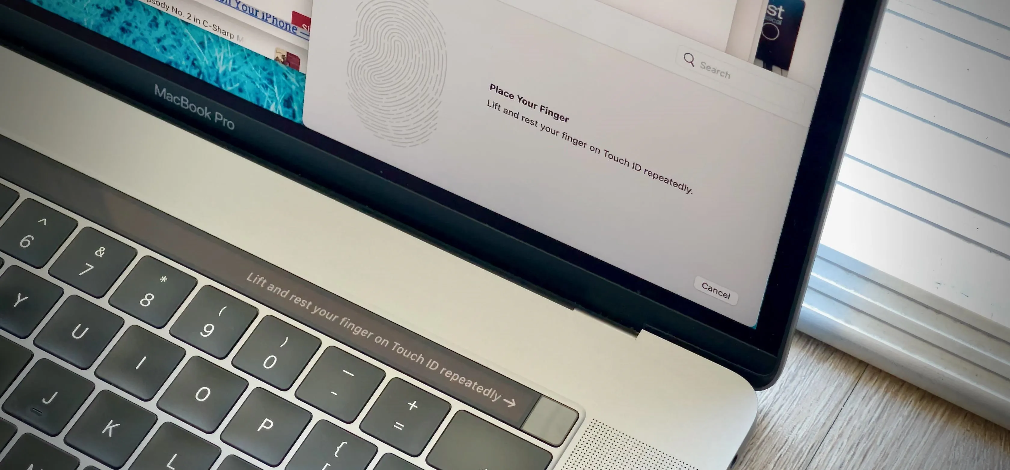 Close-up of a laptop screen showing a notification and status bar.