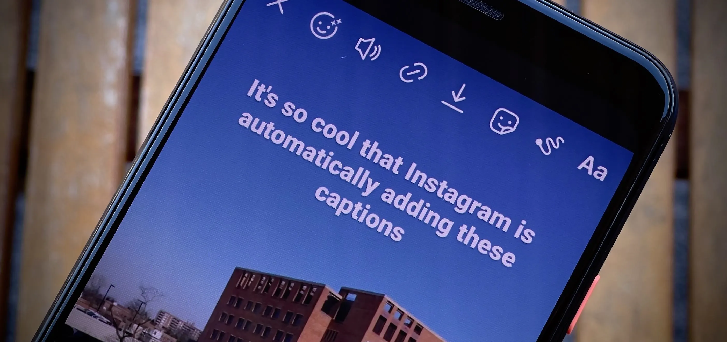 Phone displaying Instagram captions feature.