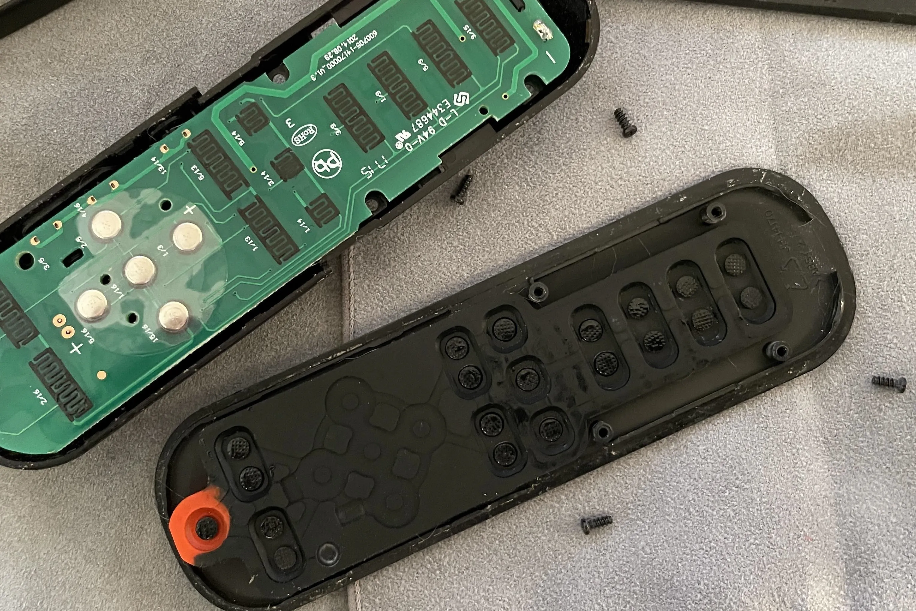 Opened remote control showing internal components.