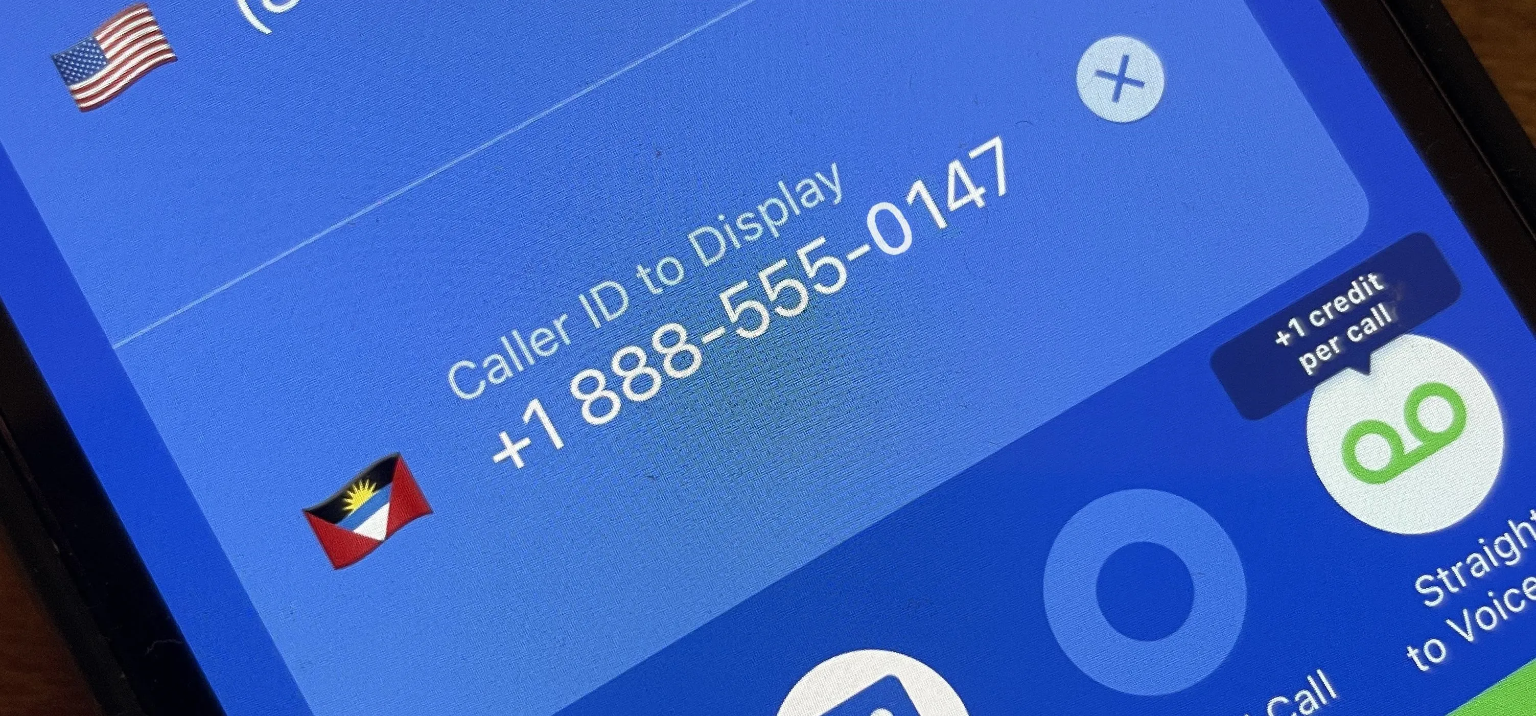 Caller ID displaying the number +1888-555-0147 on a mobile device.