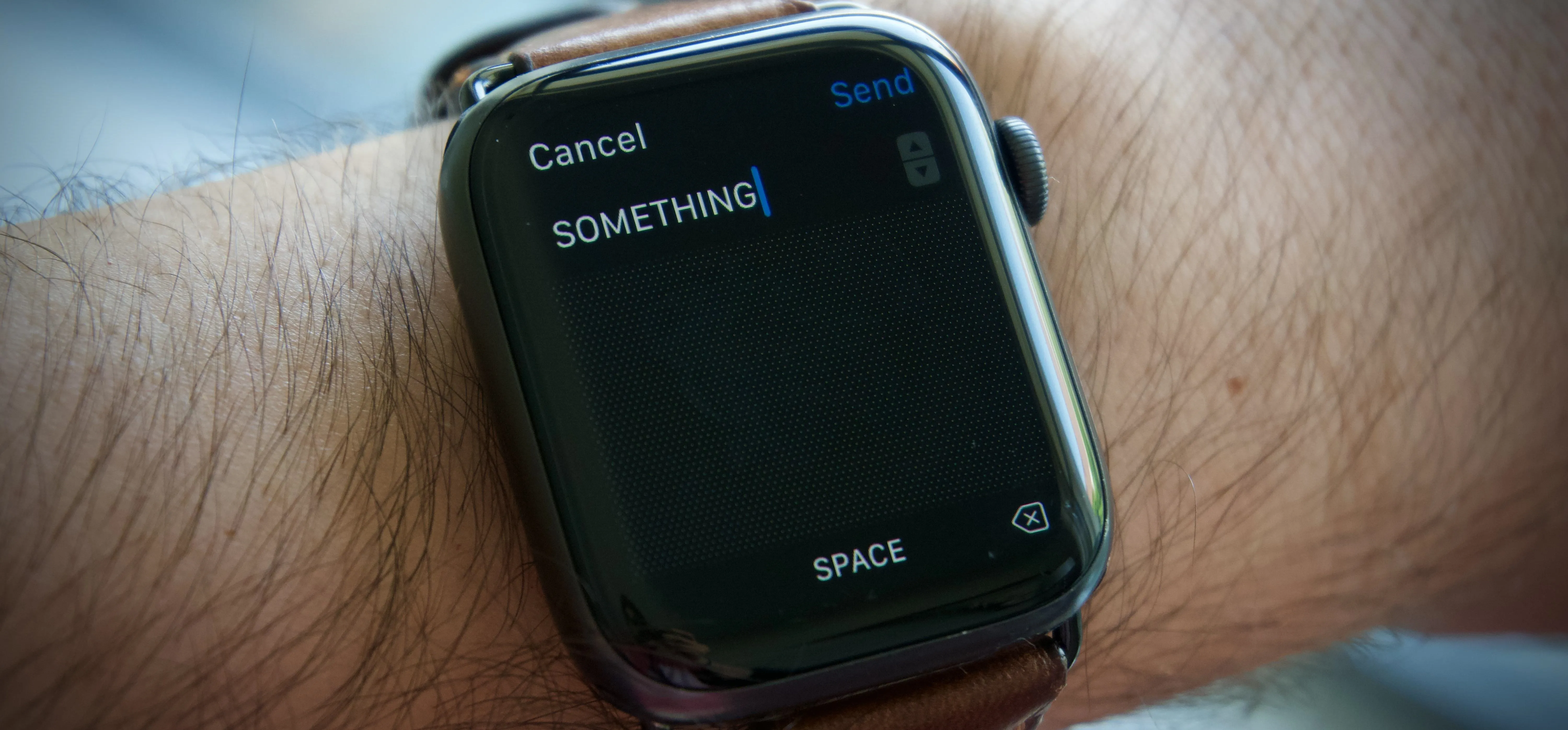 Man flexing muscles next to a fitness smartwatch displaying calorie count.