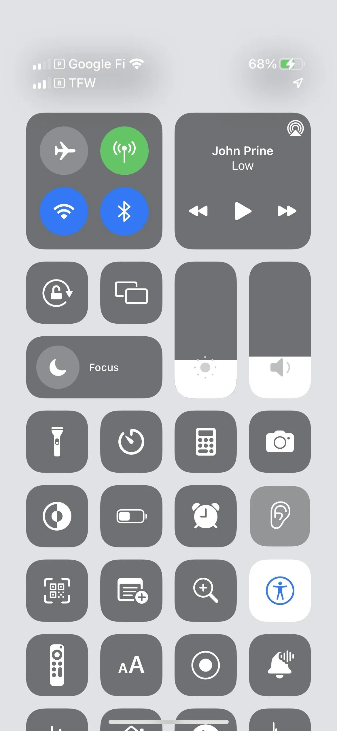 Control Center interface on a smartphone displaying various icons for connectivity and media control.