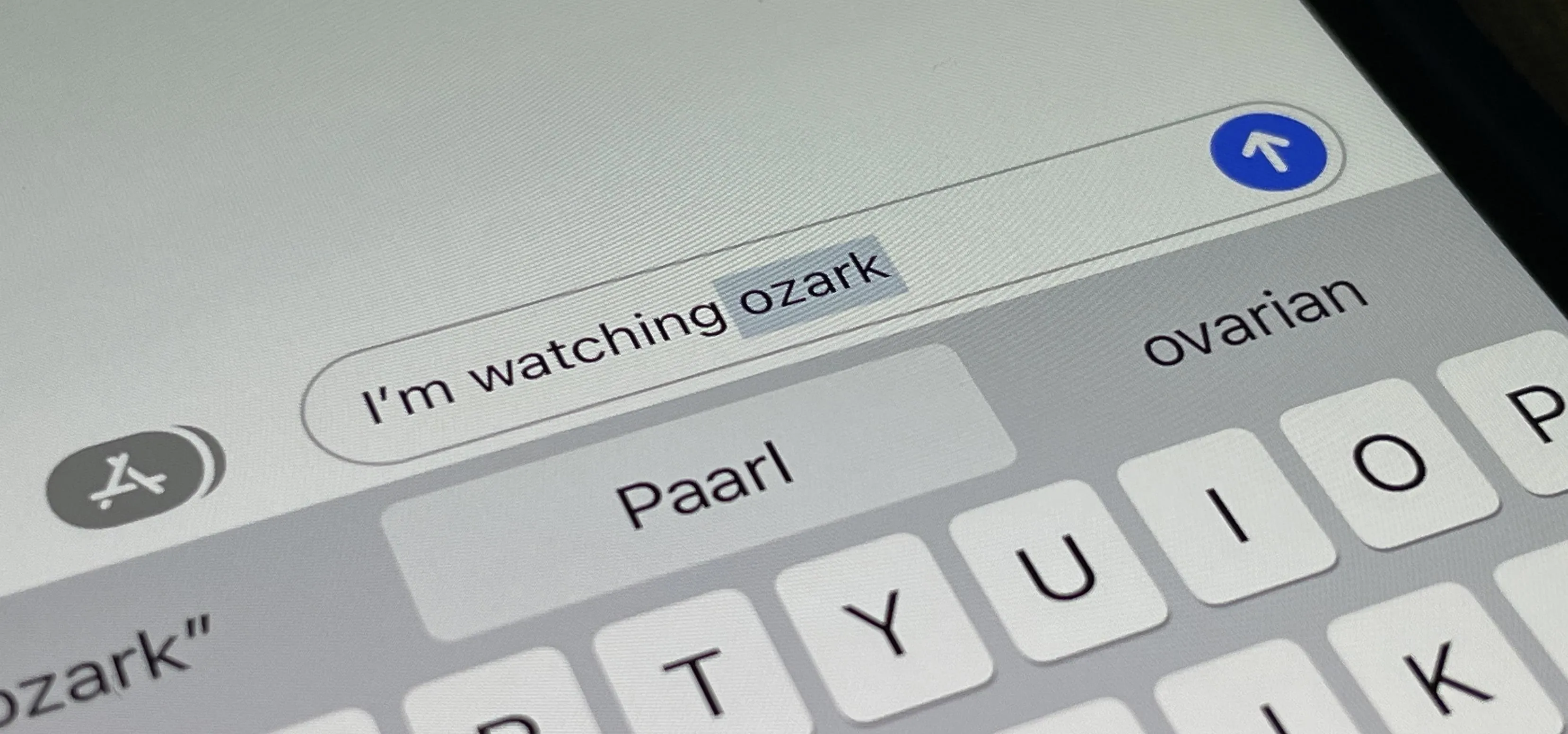 Text input on a smartphone screen displaying "I'm watching Ozark."