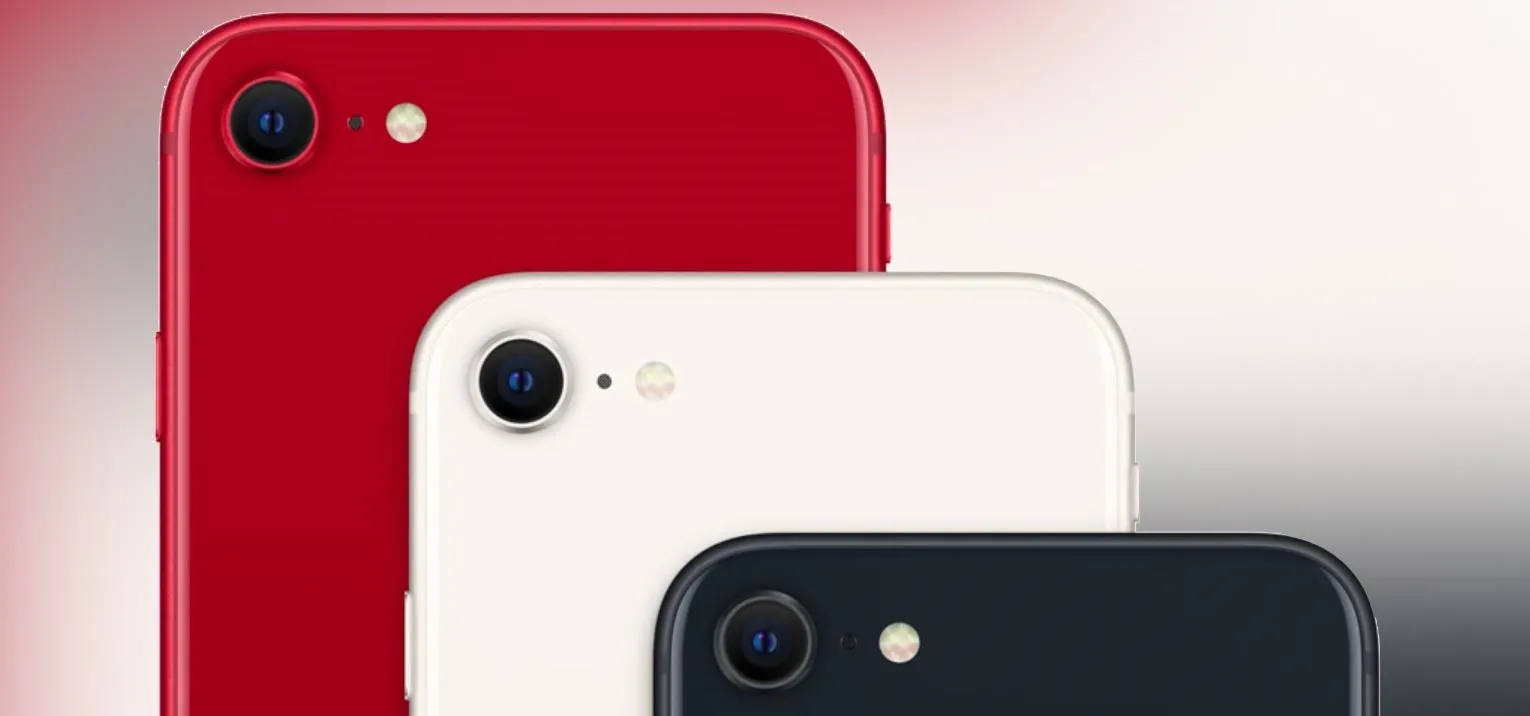 Three smartphones in red, white, and black colors, stacked together.