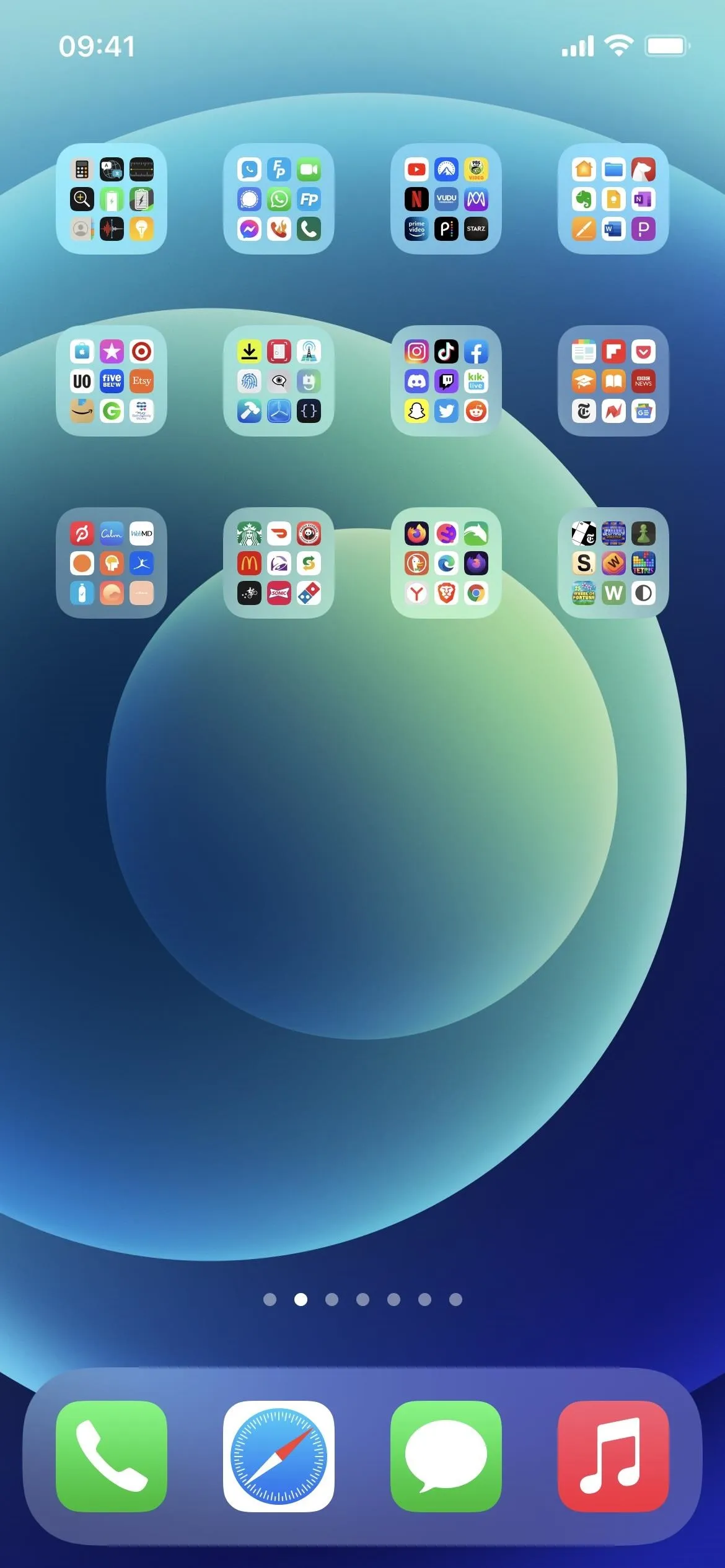 Smartphone screen displaying organized app icons and folders.