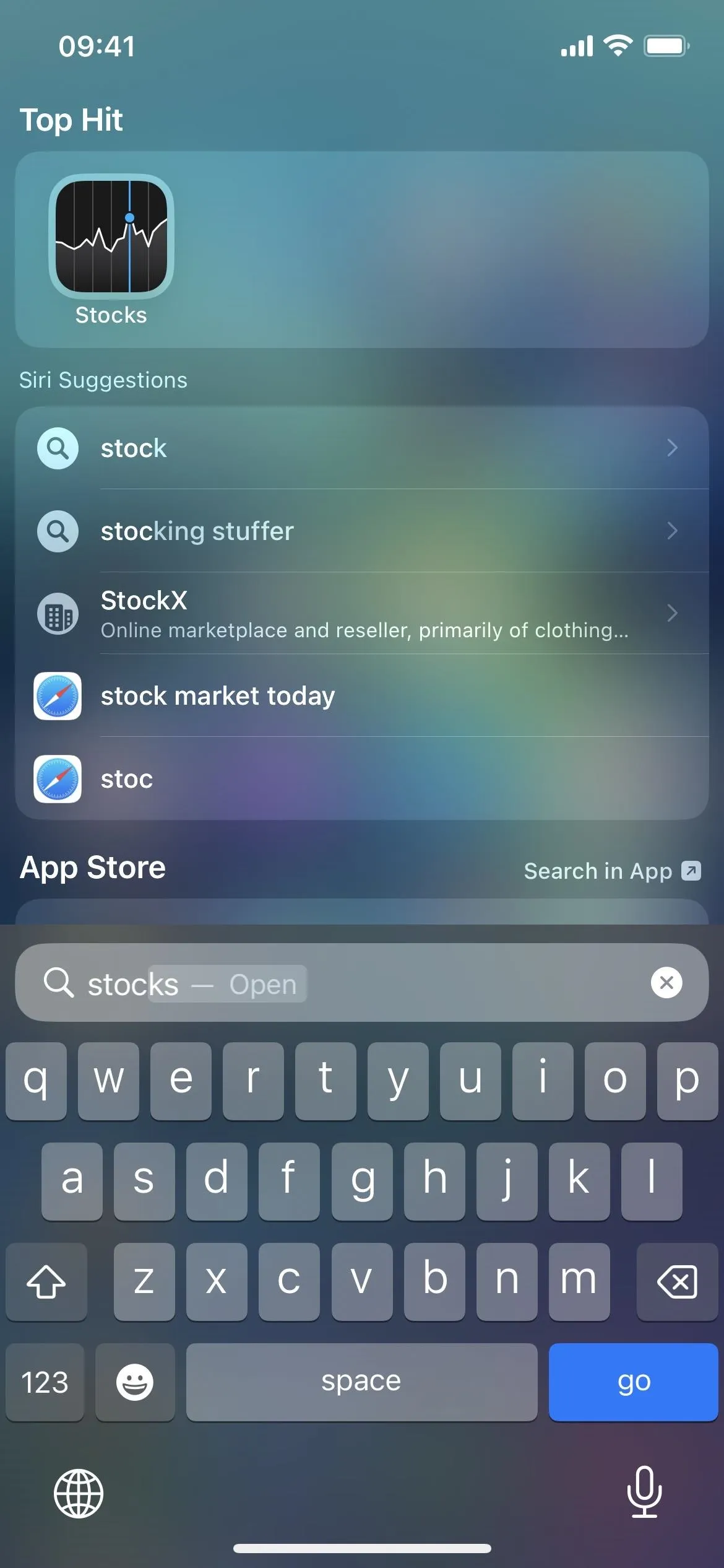 Search interface on a mobile device with app icons and a keyboard.