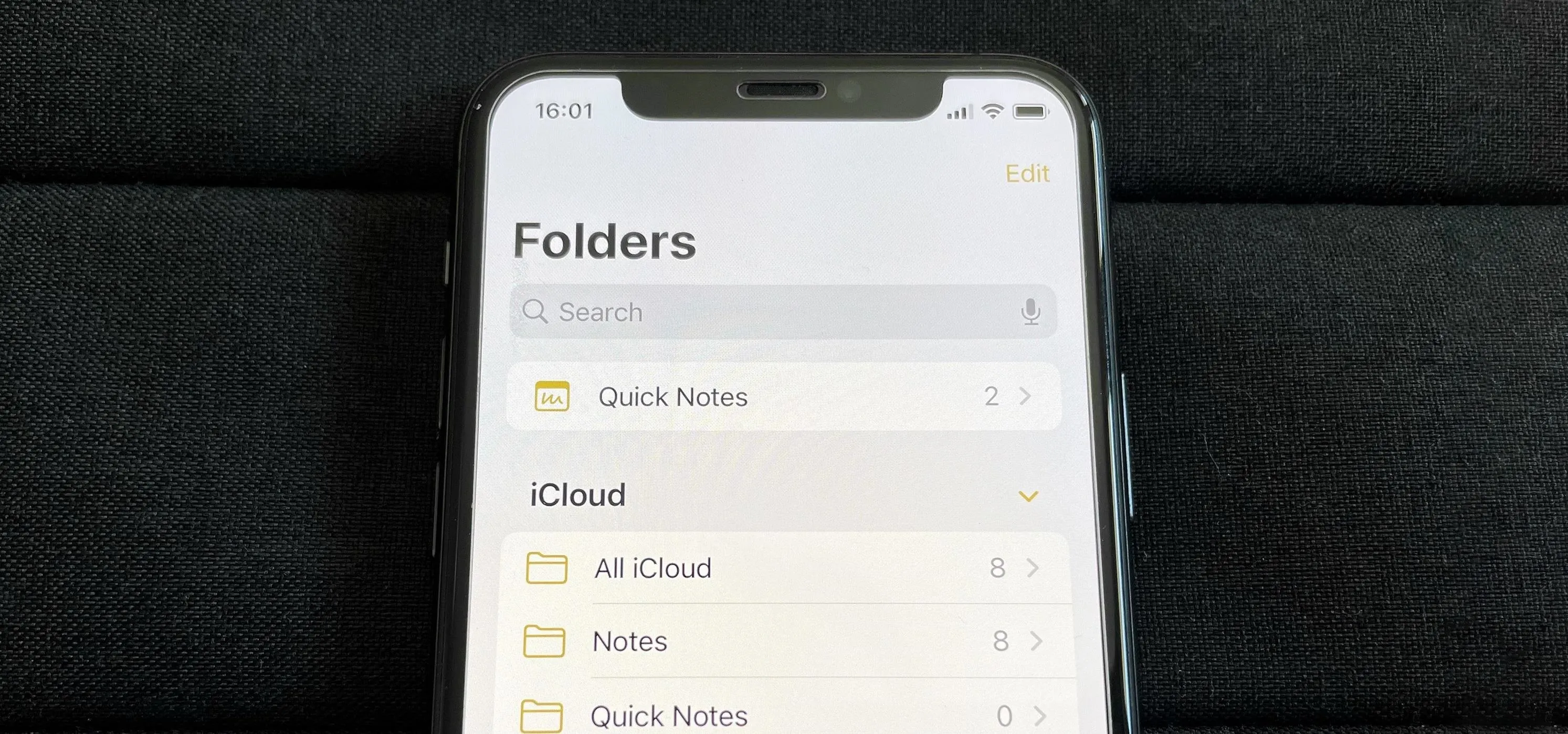 Mobile device displaying folder options in a notes application.