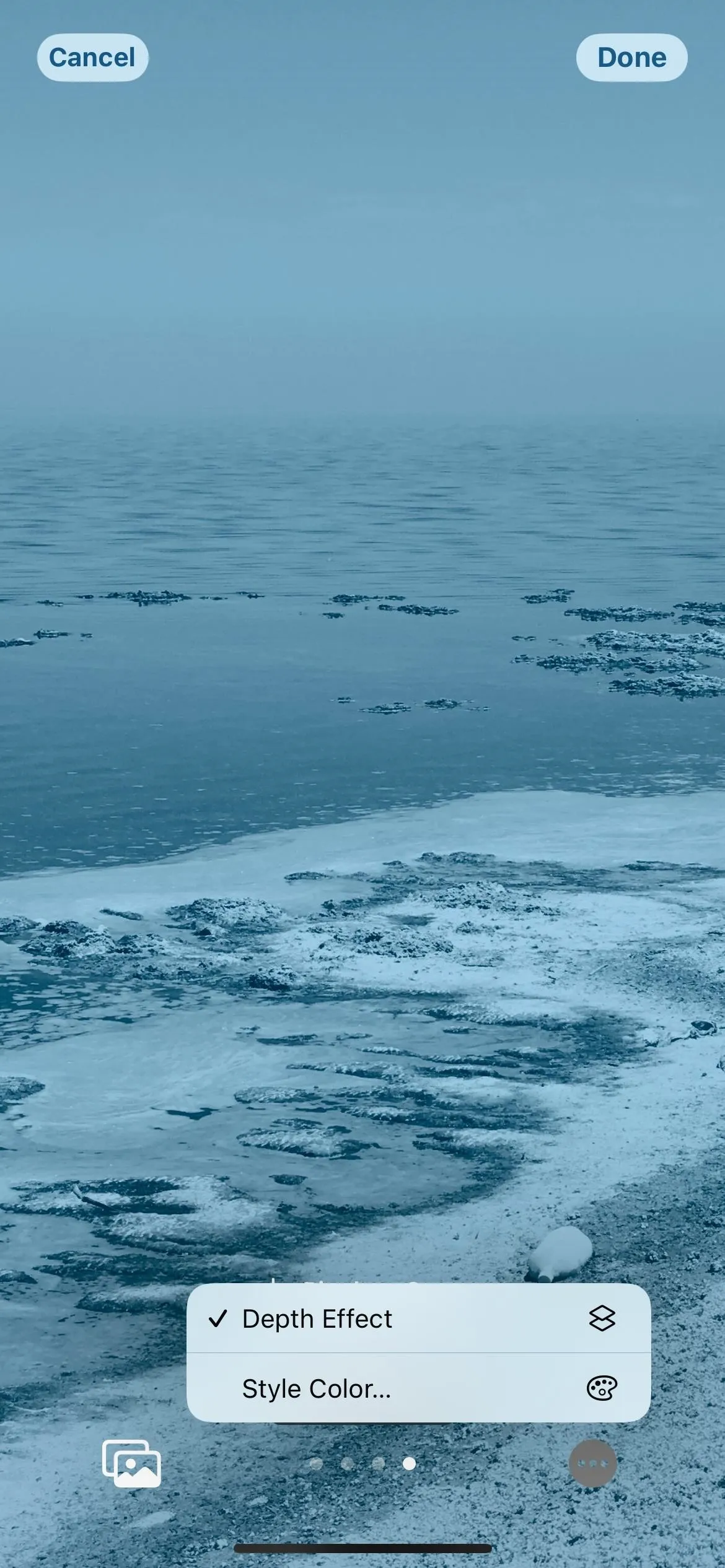 Seascape with ice formations and a gray sky.