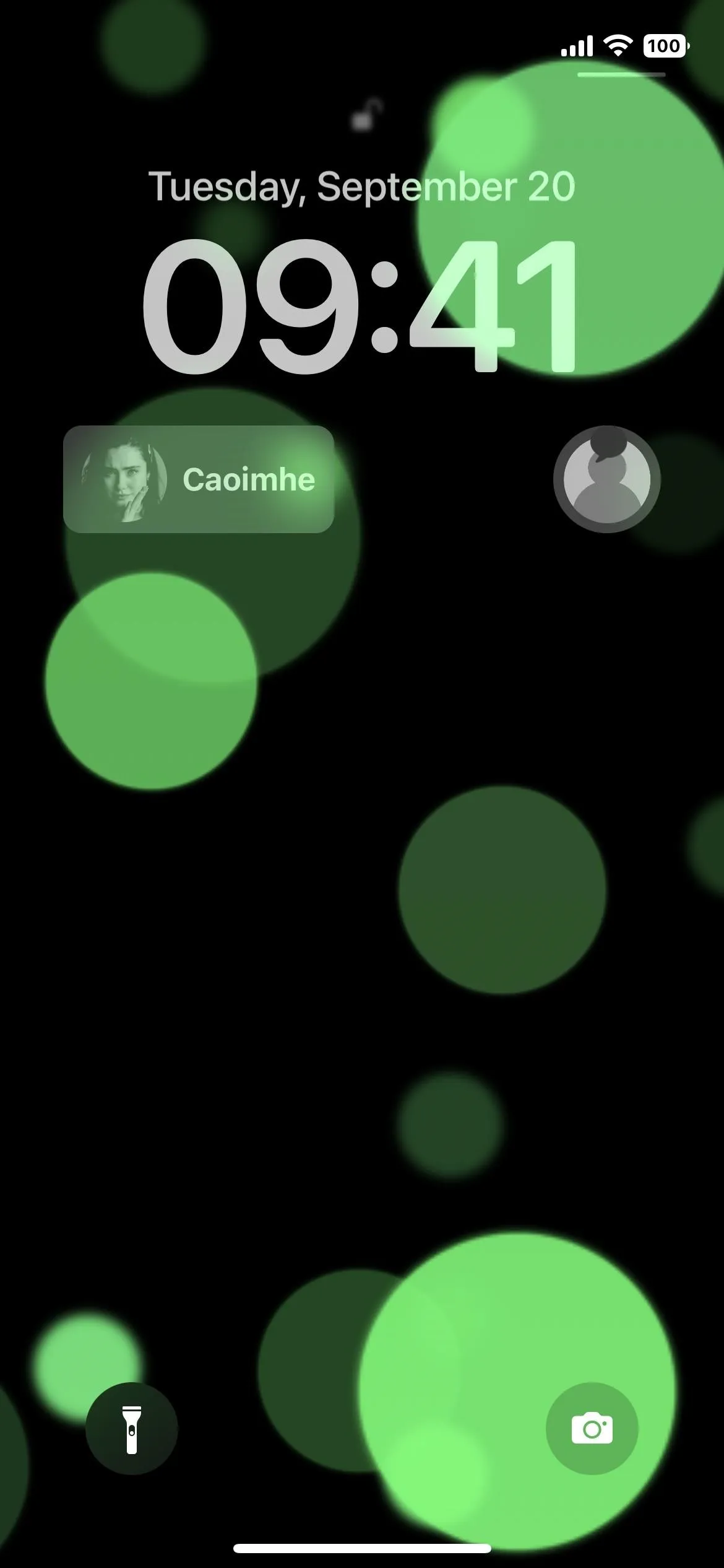 Green abstract circles with a time display on a smartphone screen.