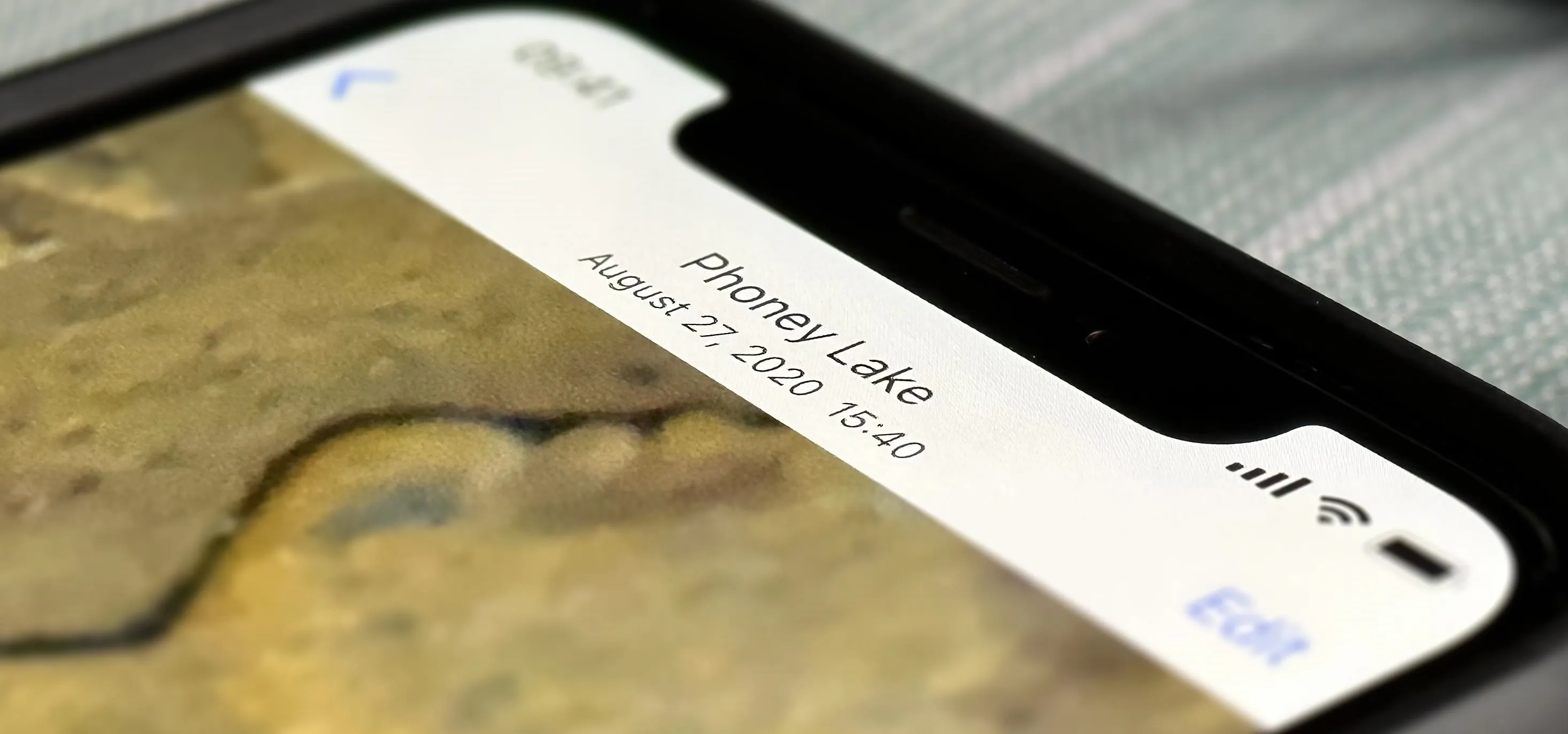 Image of a smartphone screen displaying a photo title and date.