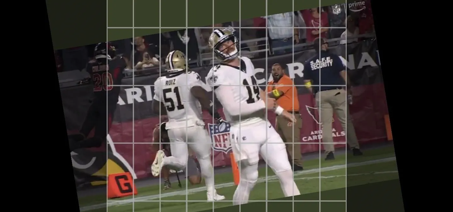 Football players celebrating on the field during a game.