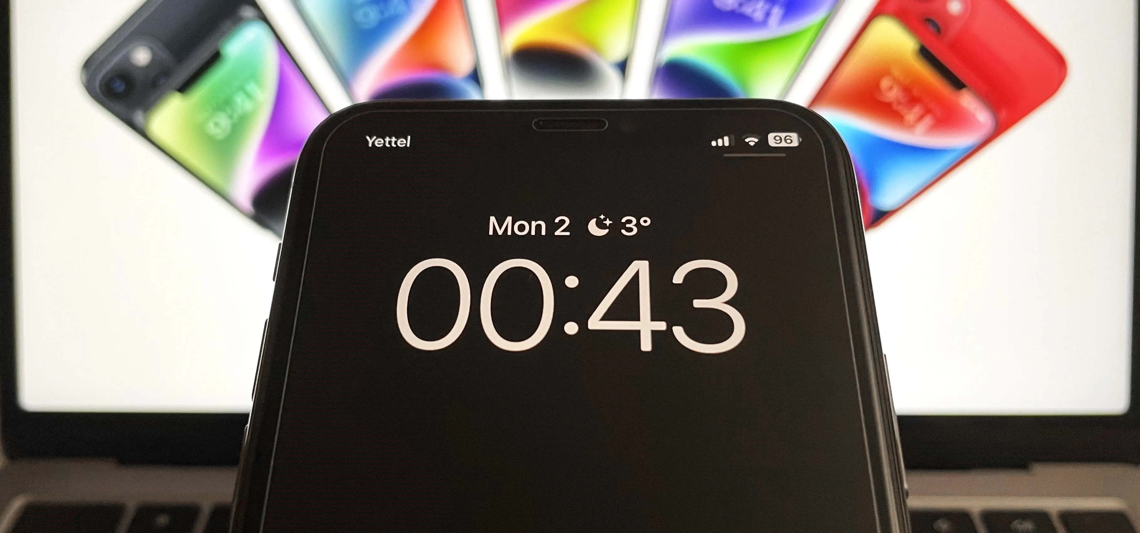 Smartphone display showing a timer with colorful phones in the background.