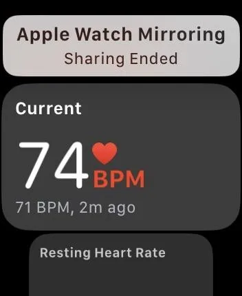 Apple Watch displaying current heart rate of 74 BPM.