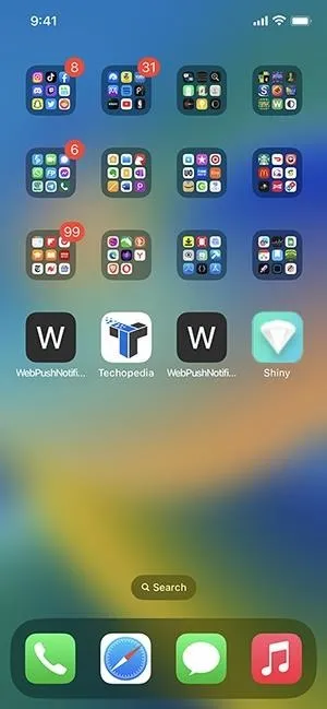 Smartphone screen displaying app icons organized in folders.