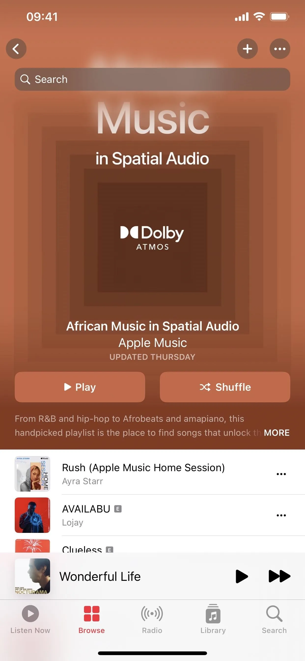 Music app interface displaying Dolby Audio features and playlist options.