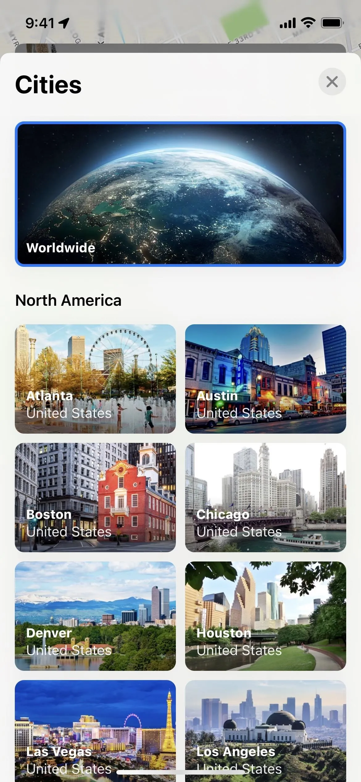 A selection of cityscapes from North America displayed on a mobile interface.