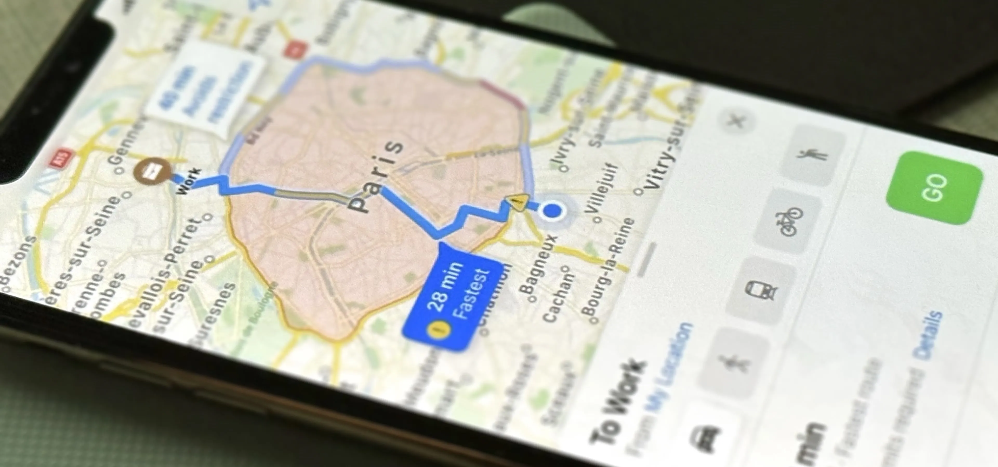 Mobile phone displaying a map with driving directions.