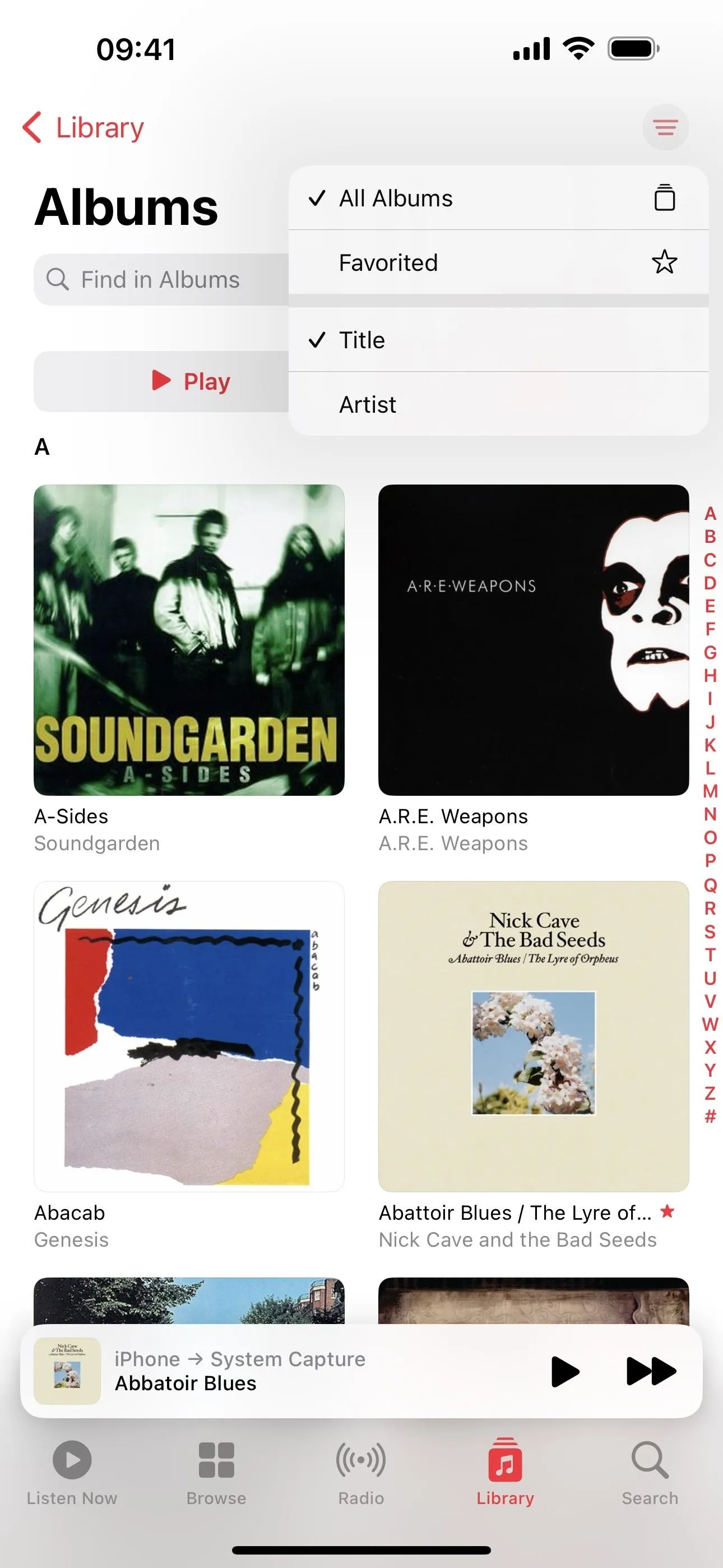 Music library interface showing various album covers and playlists.