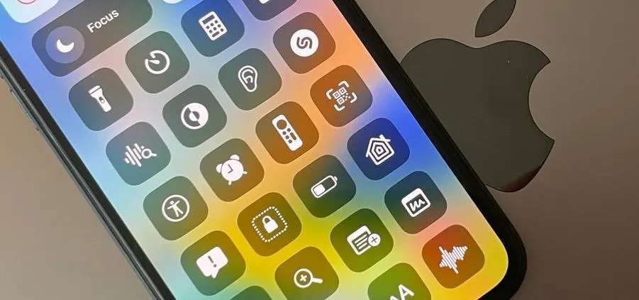 Smartphone interface displaying app icons with an Apple logo in the background.