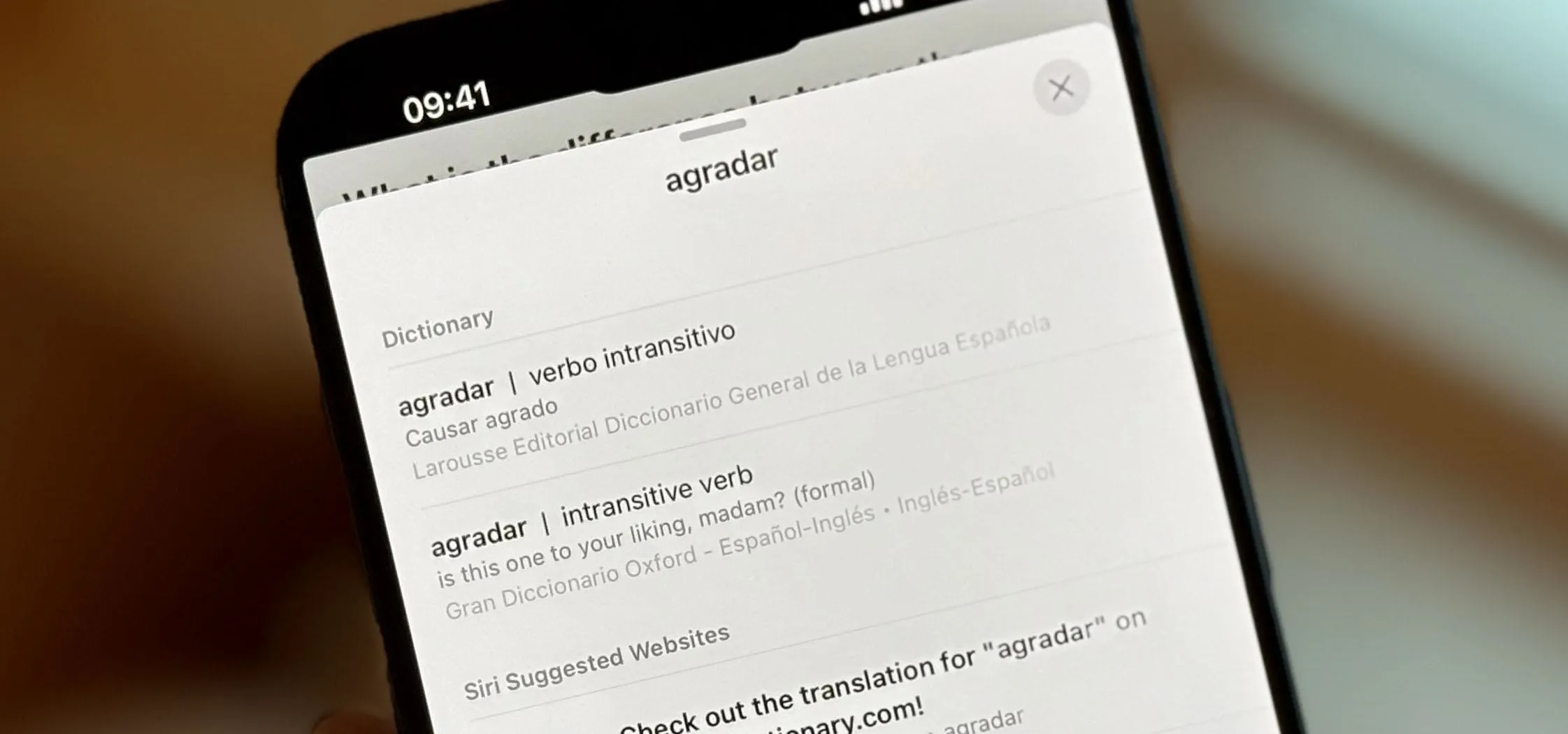 Text message displayed on a smartphone with virtual keyboard options.