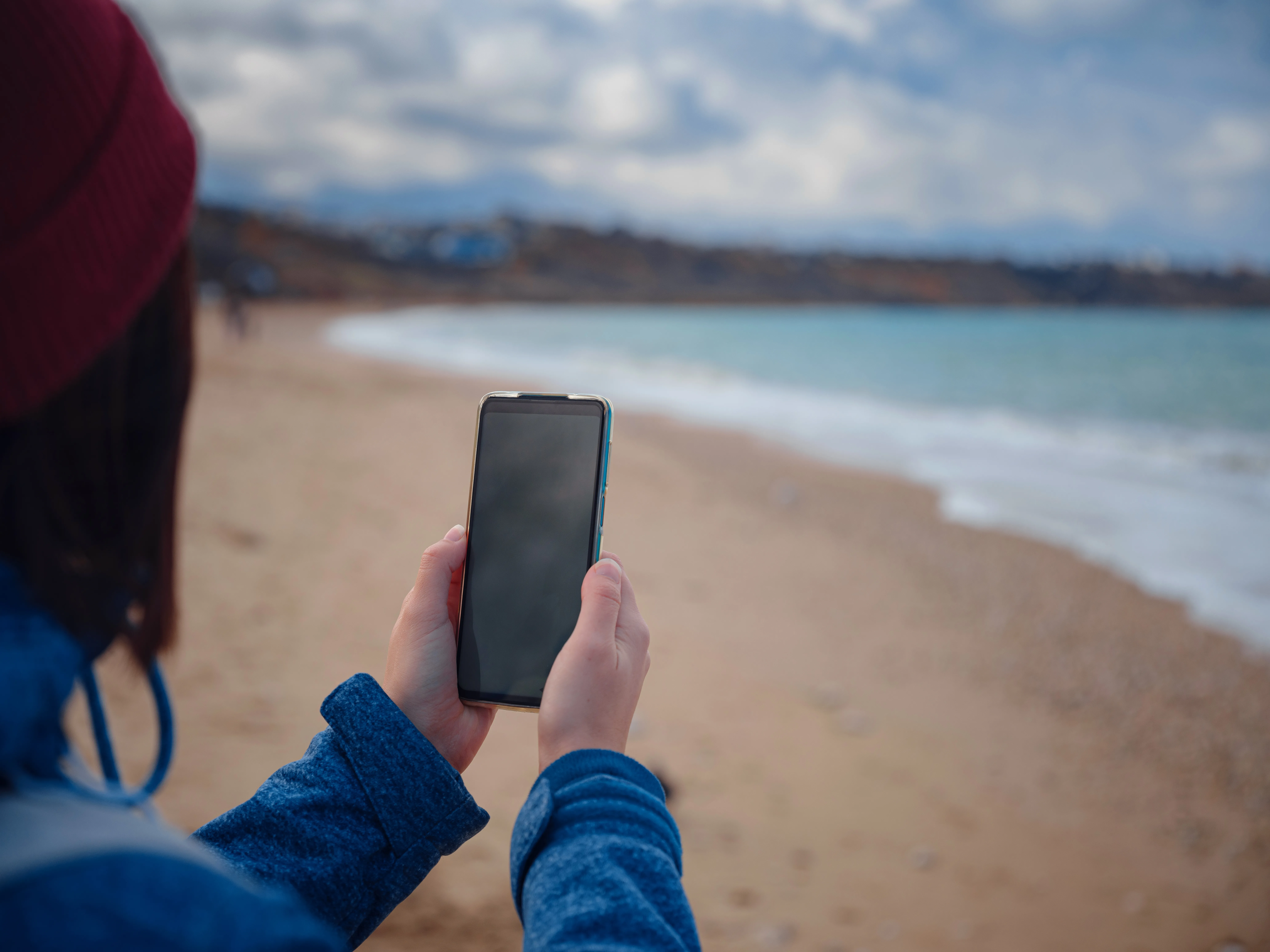 Photo of a person taking a photo using a smartphone