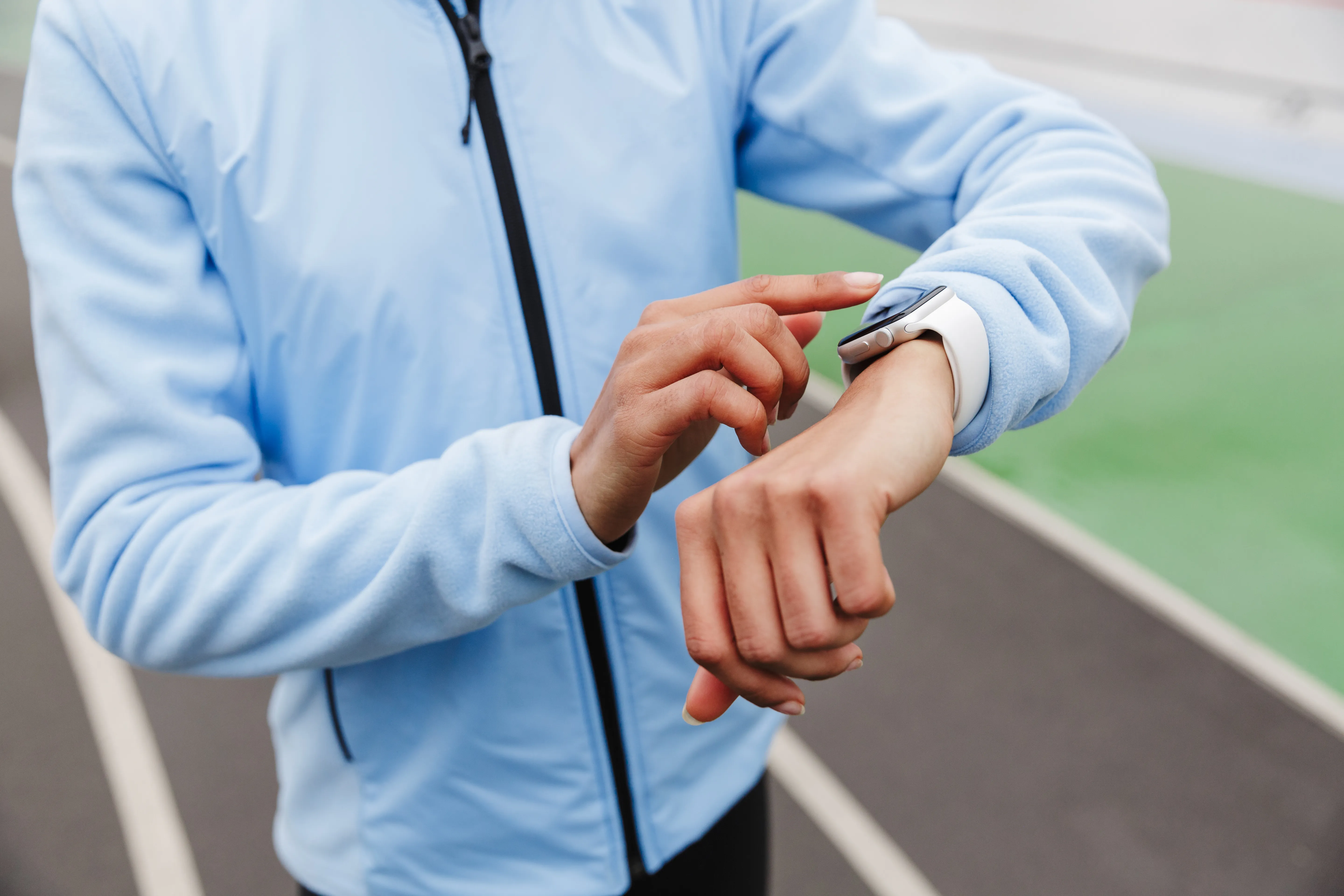 Image of a jogger using a smart watch