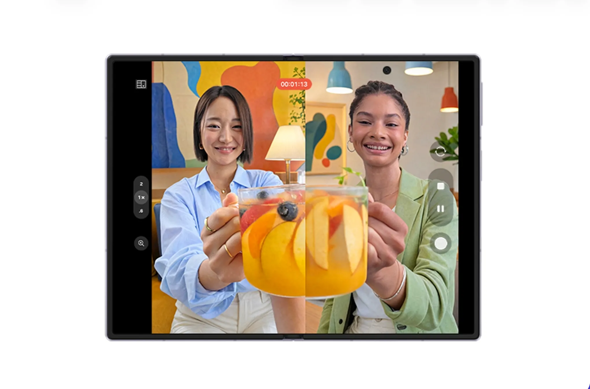 Galaxy Z Fold8 unfolded with two people recording a video call-style scene on its large inner display