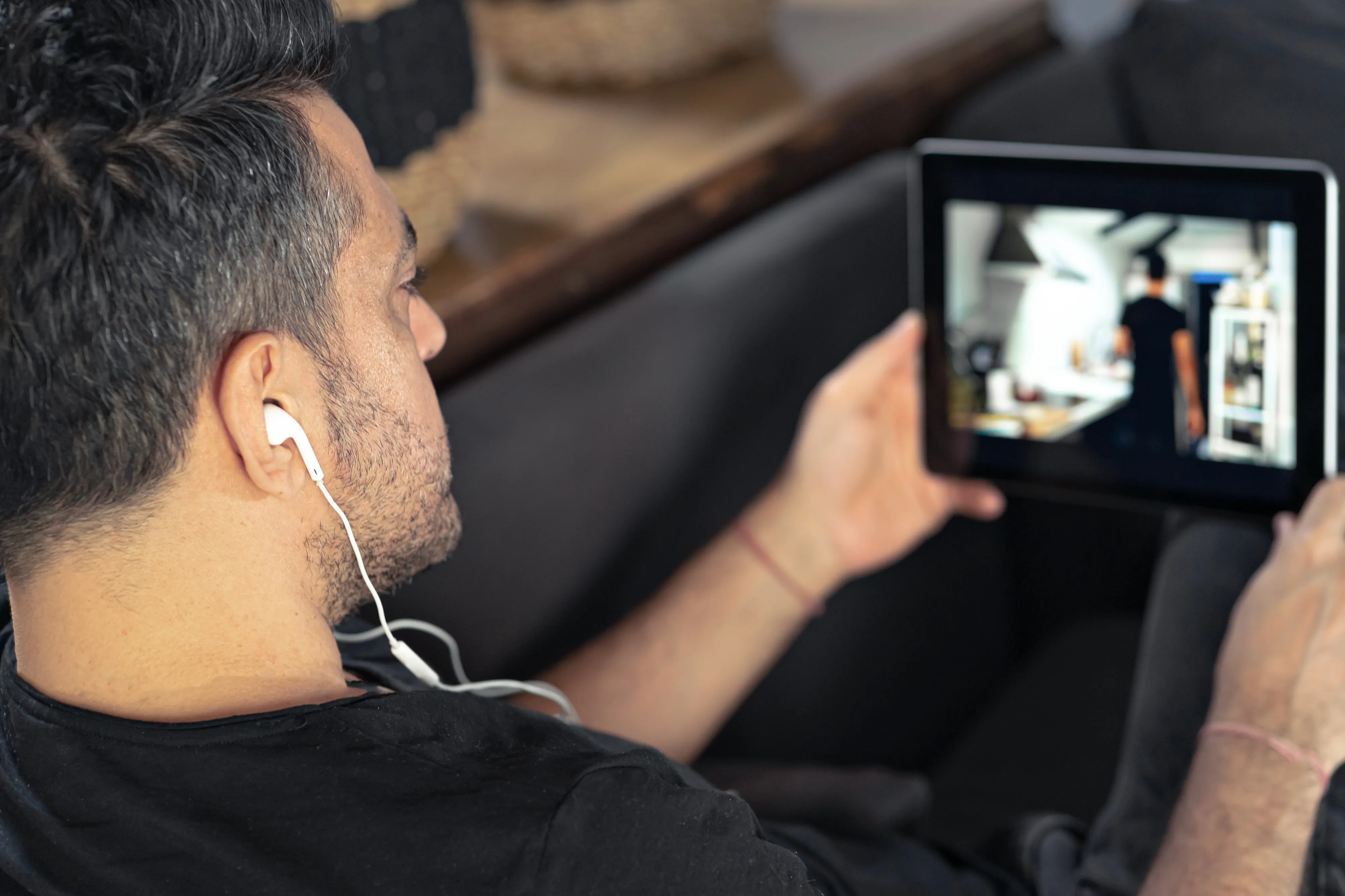 image of someone streaming a movie on a tablet