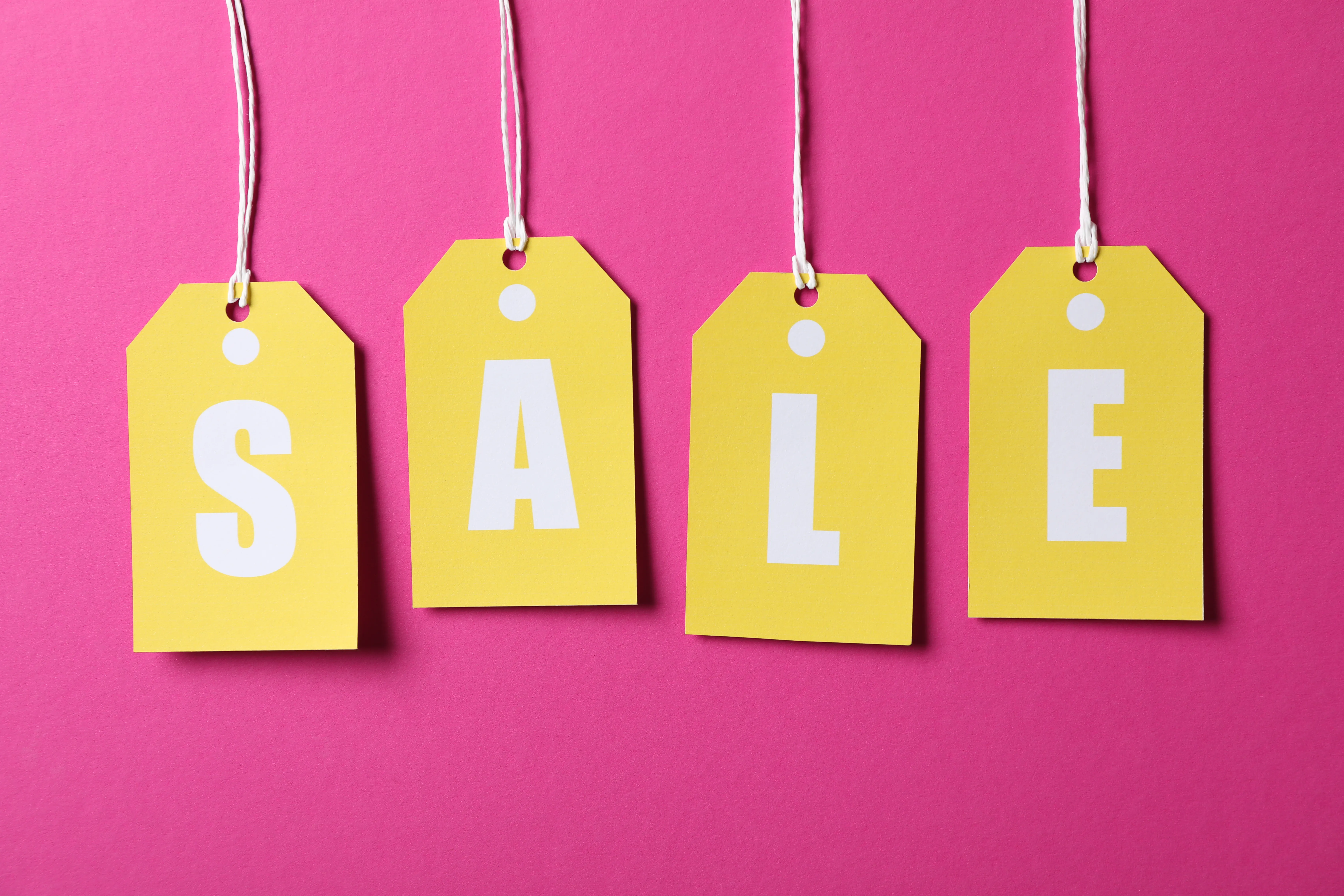 an image with price tags that spells out the word "sale"