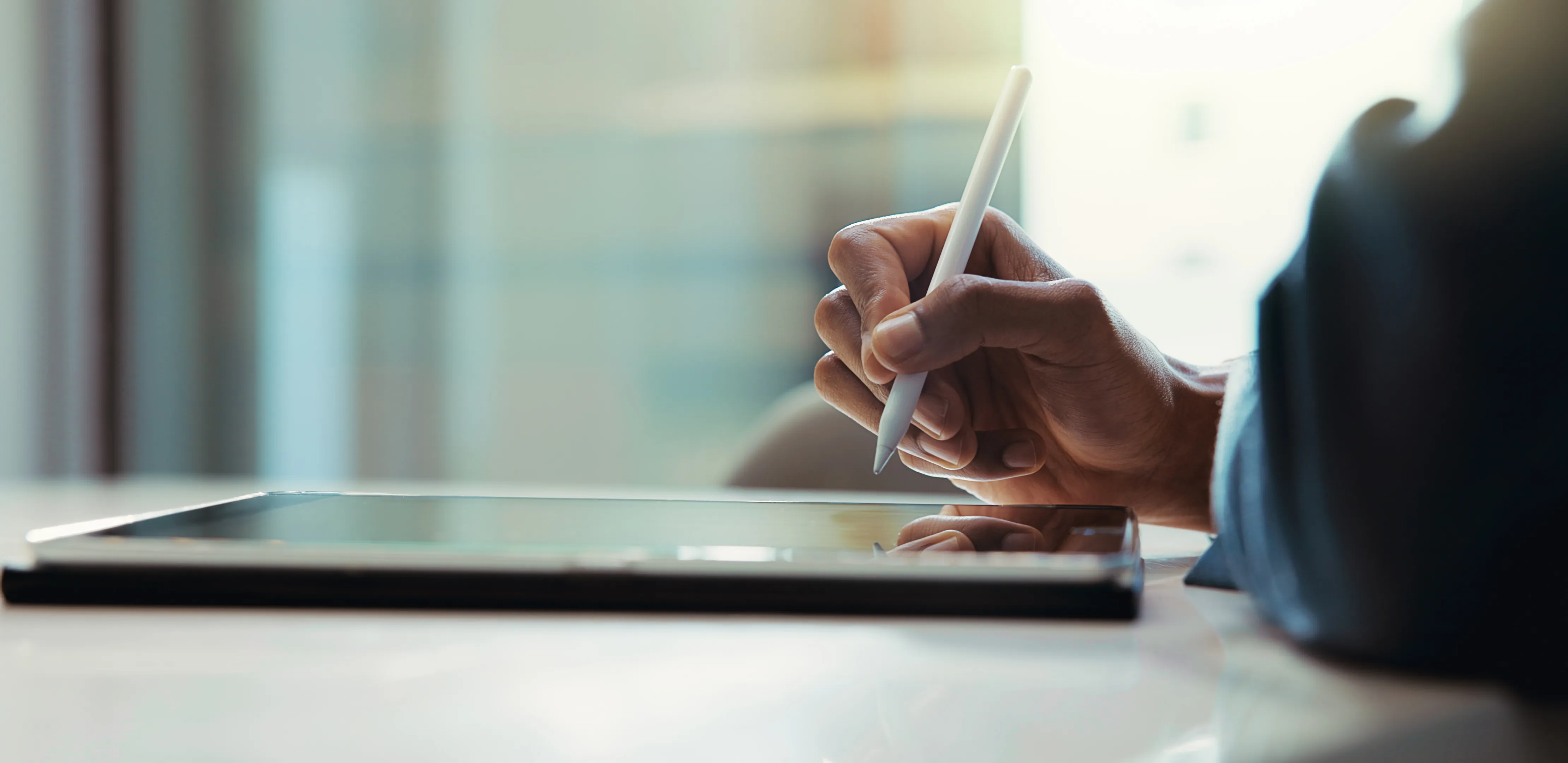 image of someone using an apple pencil with an ipad