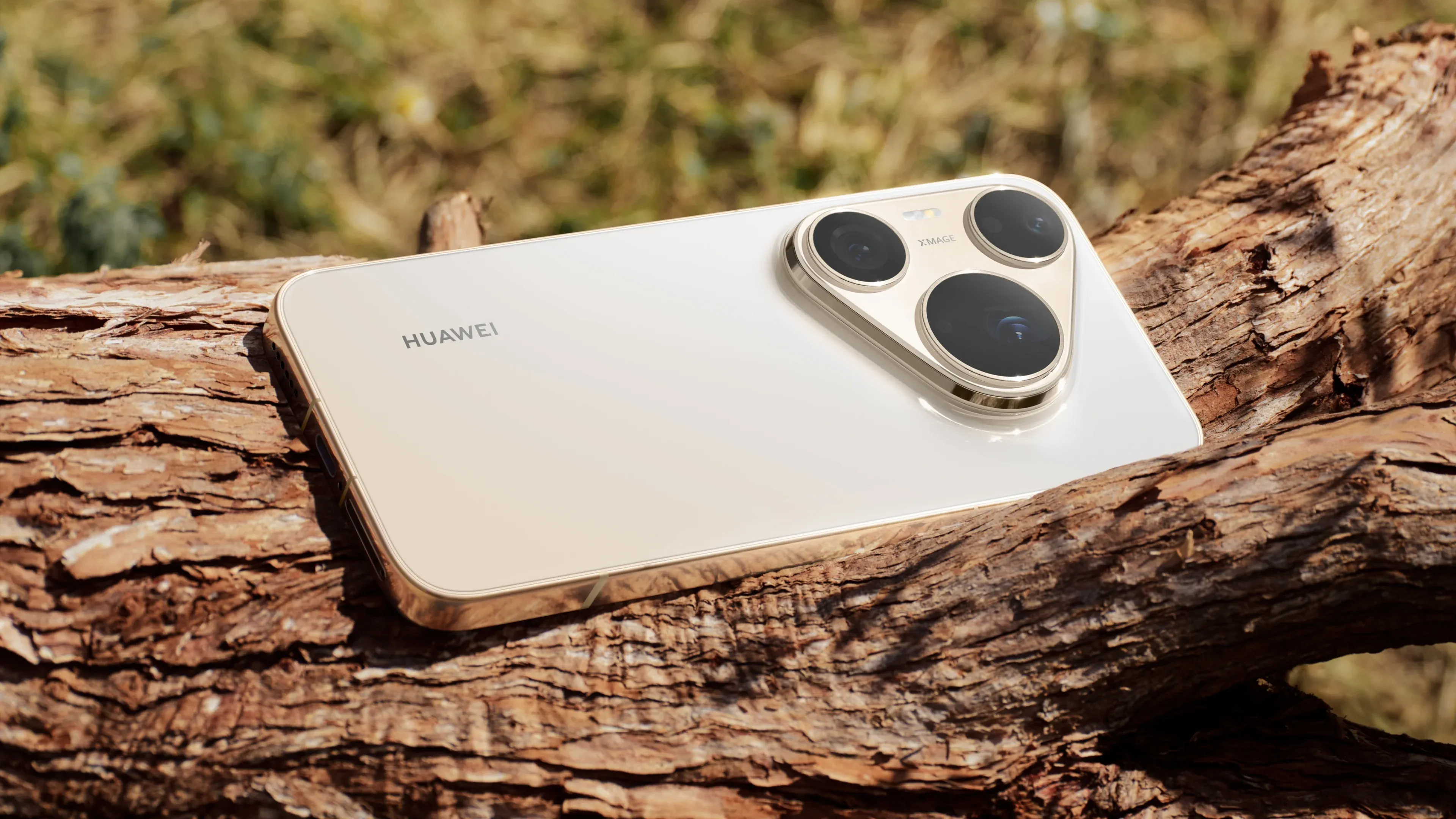 Huawei Pura 90s Pro Max in white resting on a tree trunk, with its triangular triple-camera module visible