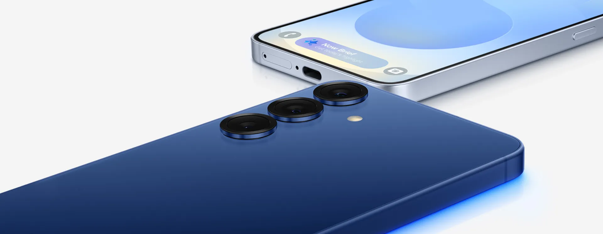 Samsung Galaxy S25 phones in blue and silver, showing the camera lenses and display close-up