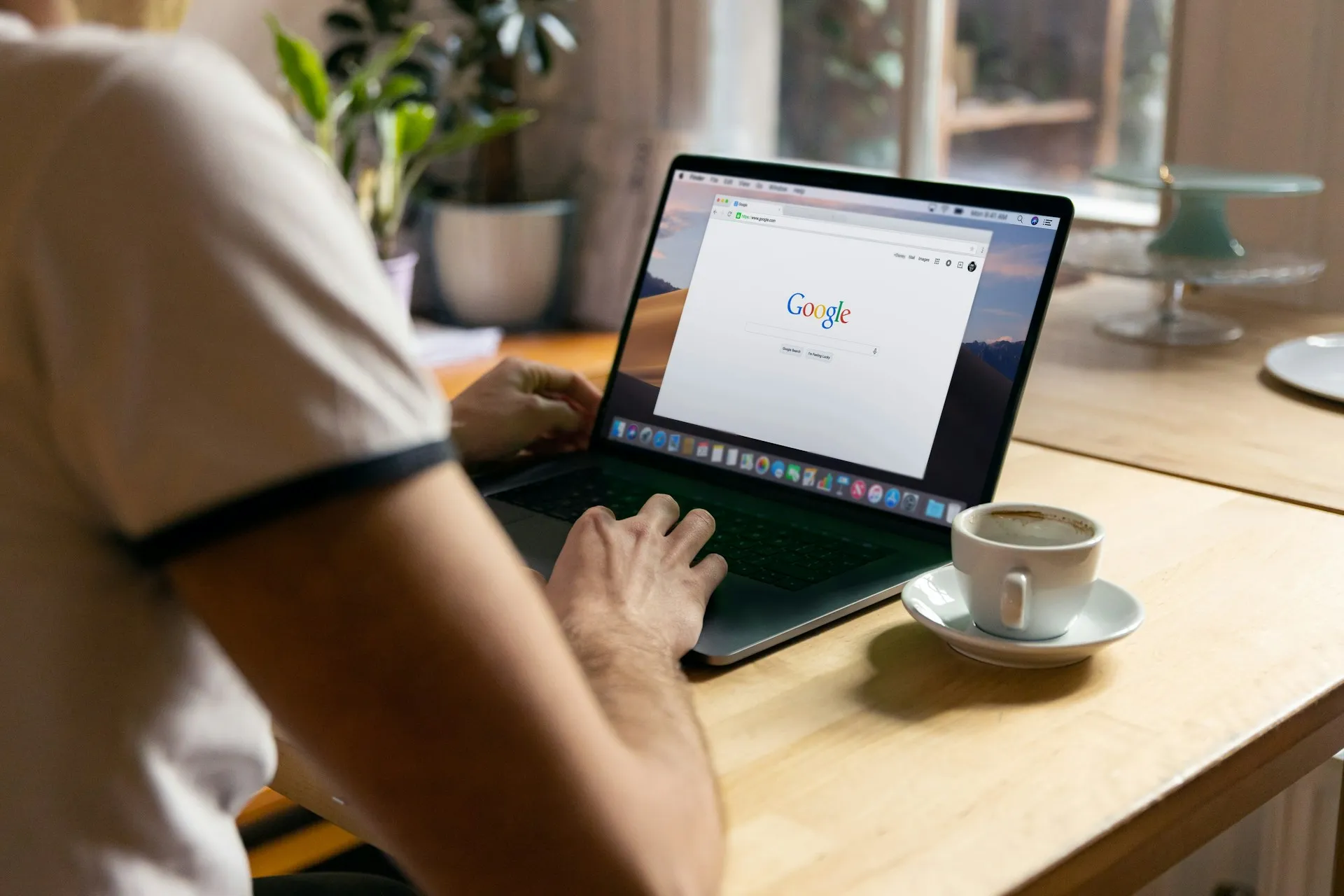 image of someone using the Google search engine on their laptop