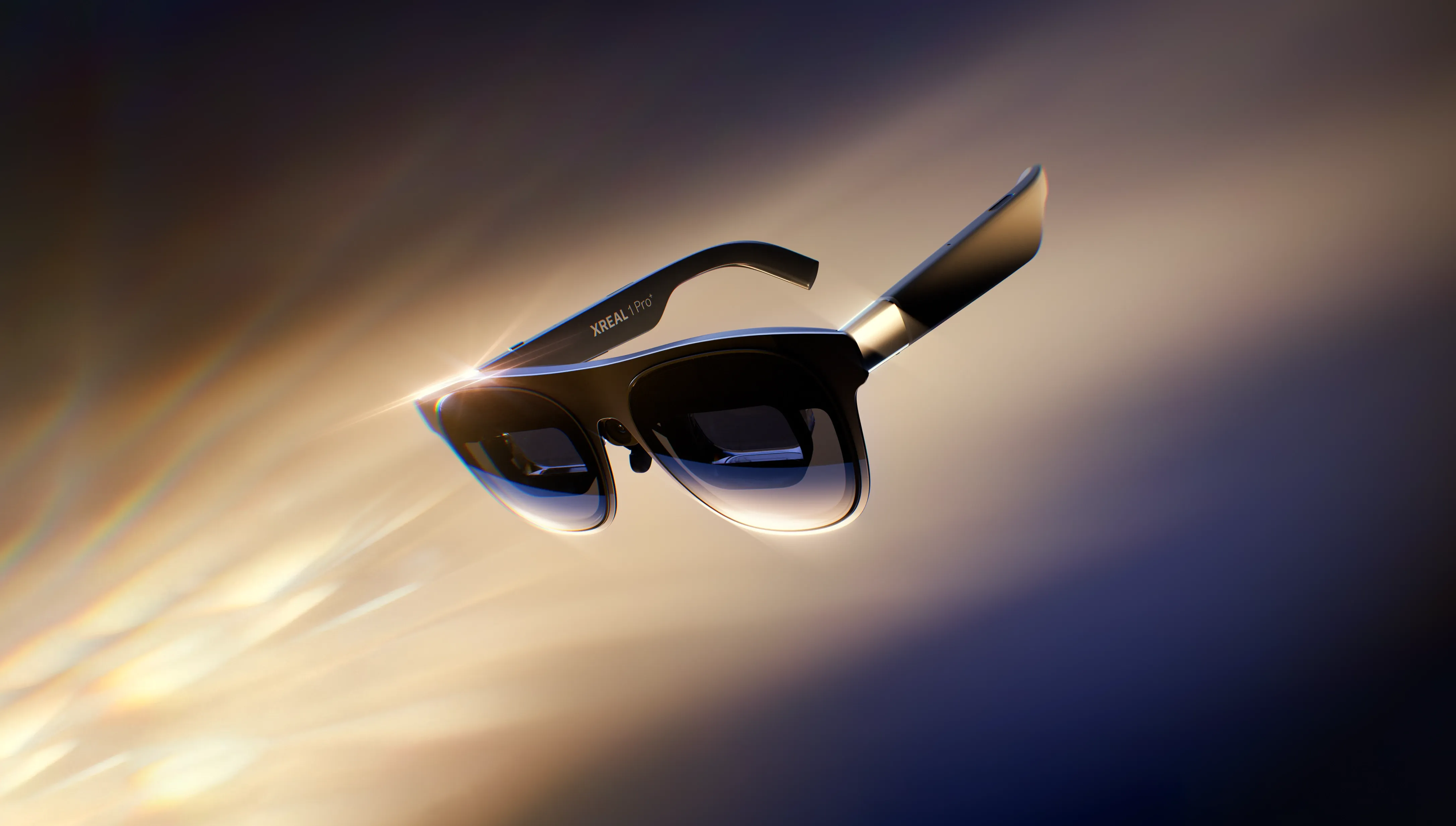 XREAL 1 Pro+ AR glasses shown in a three-quarter view, highlighting their dark lenses, angular frames, and sleek wearable display design
