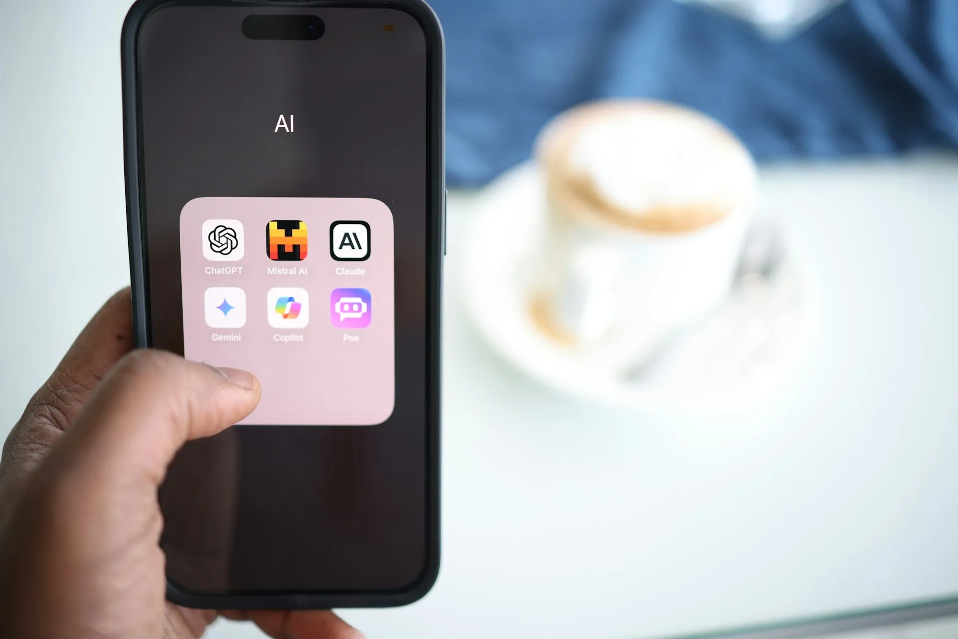 AI tools, including chatGPT, Claude, and Gemini on a phone app folder