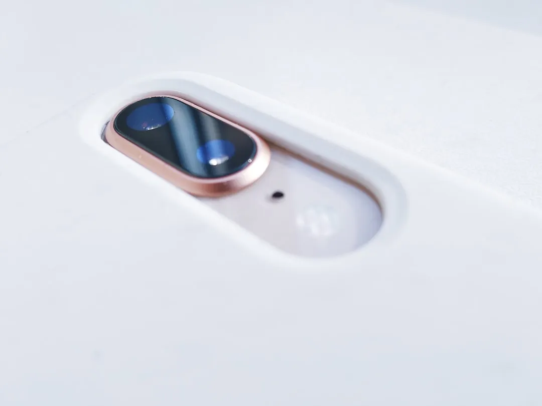 image of someone watching a video on a table wearing wireless earphones