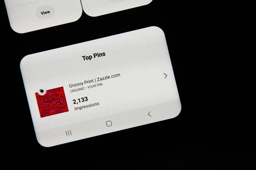 Nexus smartphone held in hand with Huawei logo blurred in the background.