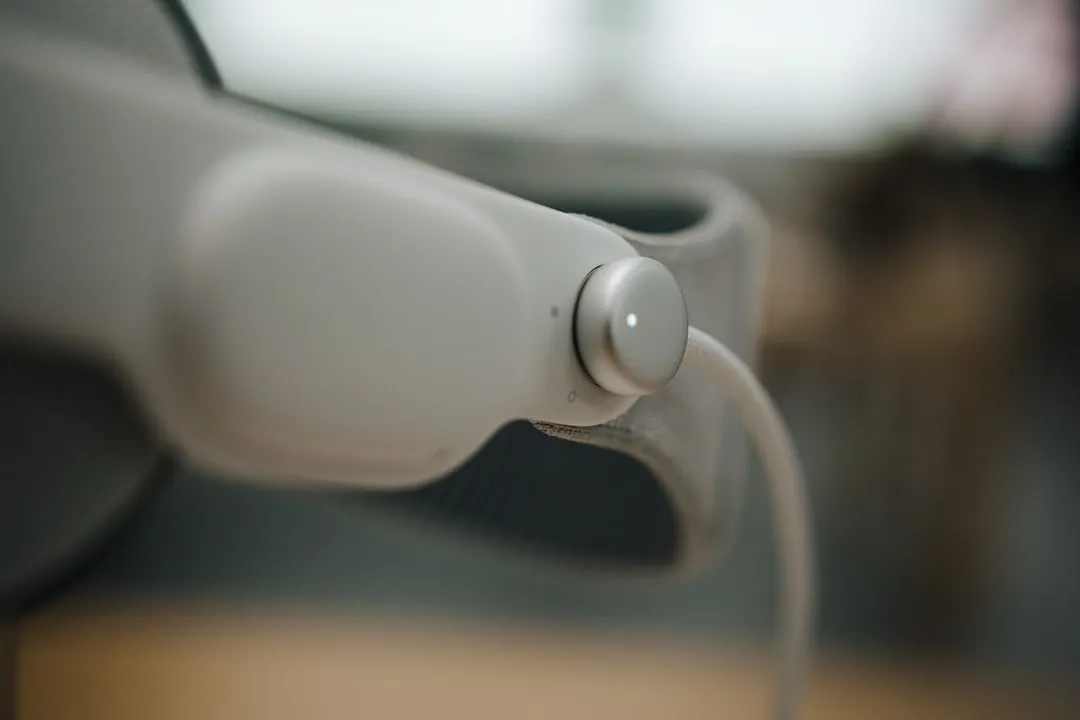 image of someone watching a video on a table wearing wireless earphones