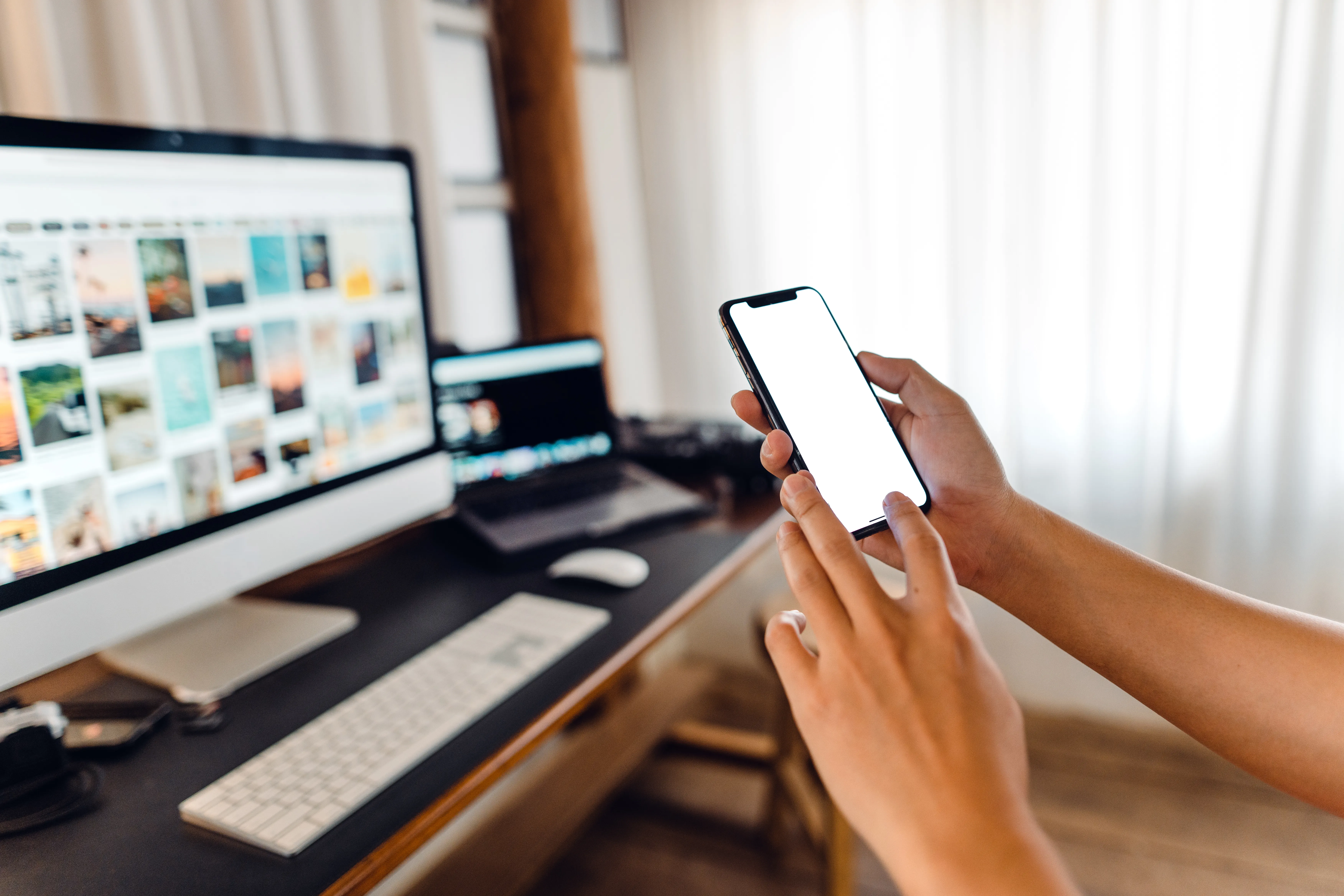 a photo of a hand holding a smartphone.