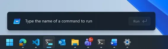 Windows 11’s redesigned Run dialog above the taskbar, showing a command field, Run button, and pinned app icons