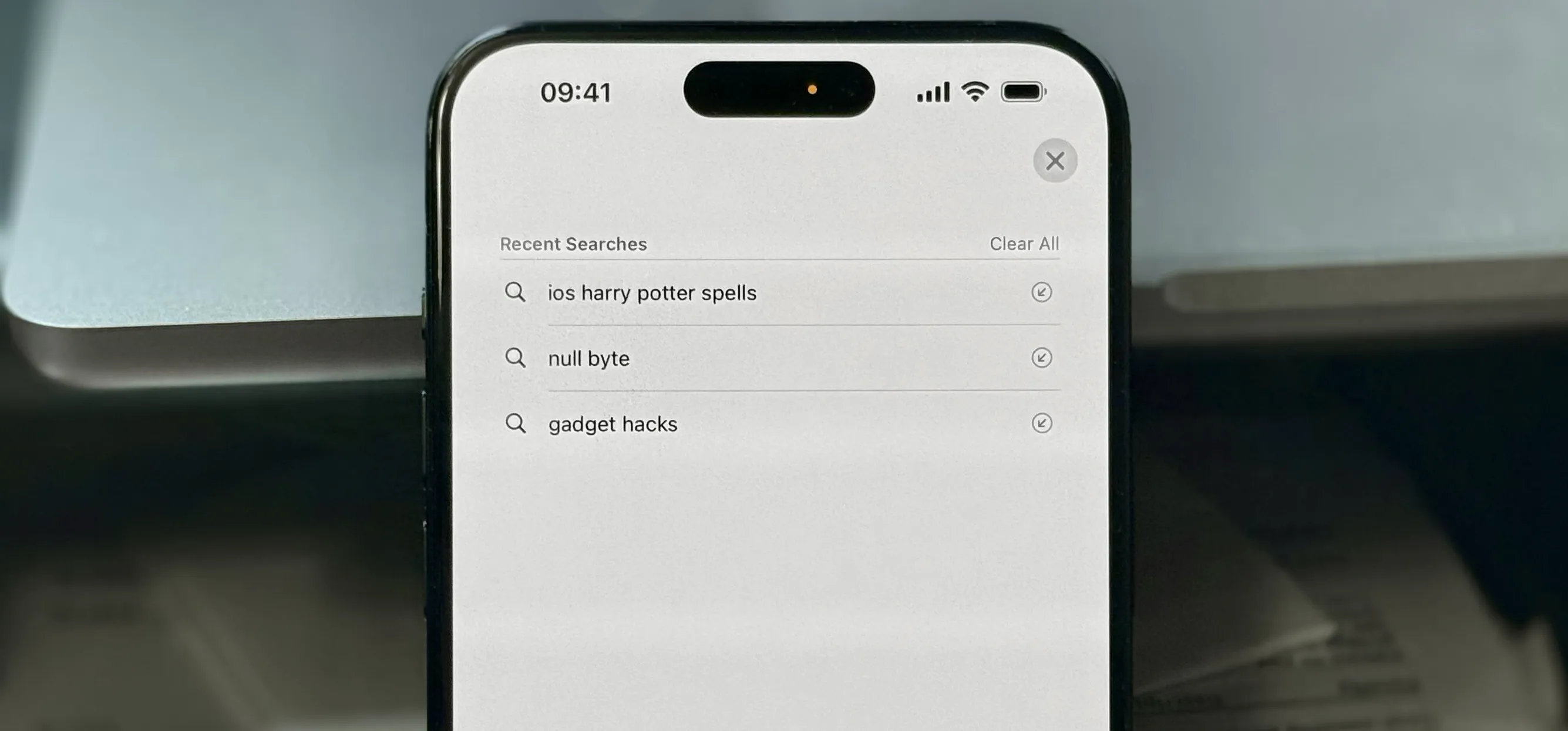 iPhone screen showing Safari’s recent searches list with “ios harry potter spells,” “null byte,” and “gadget hacks” as the top three entries.