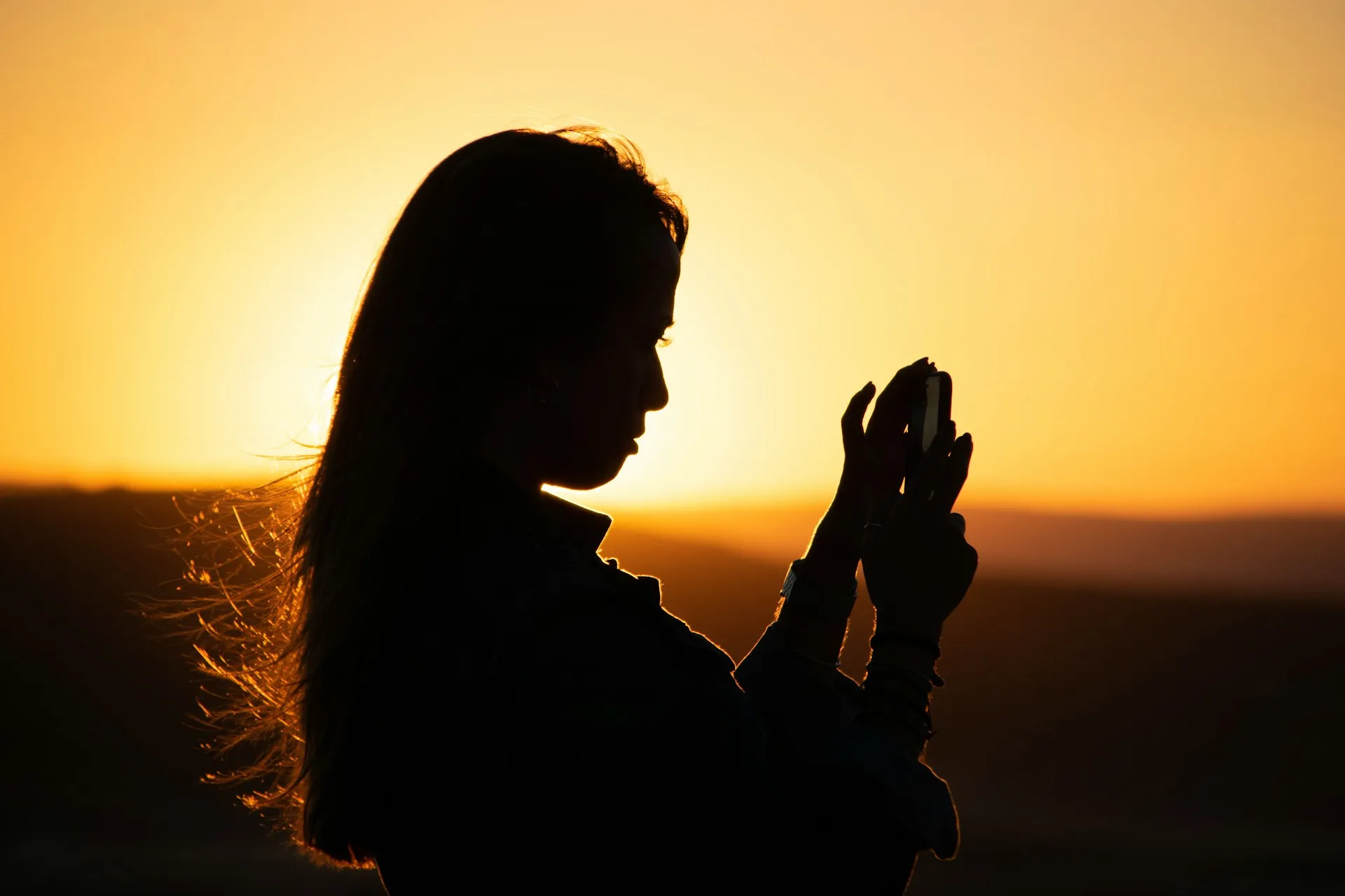 girl taking a photo using phone