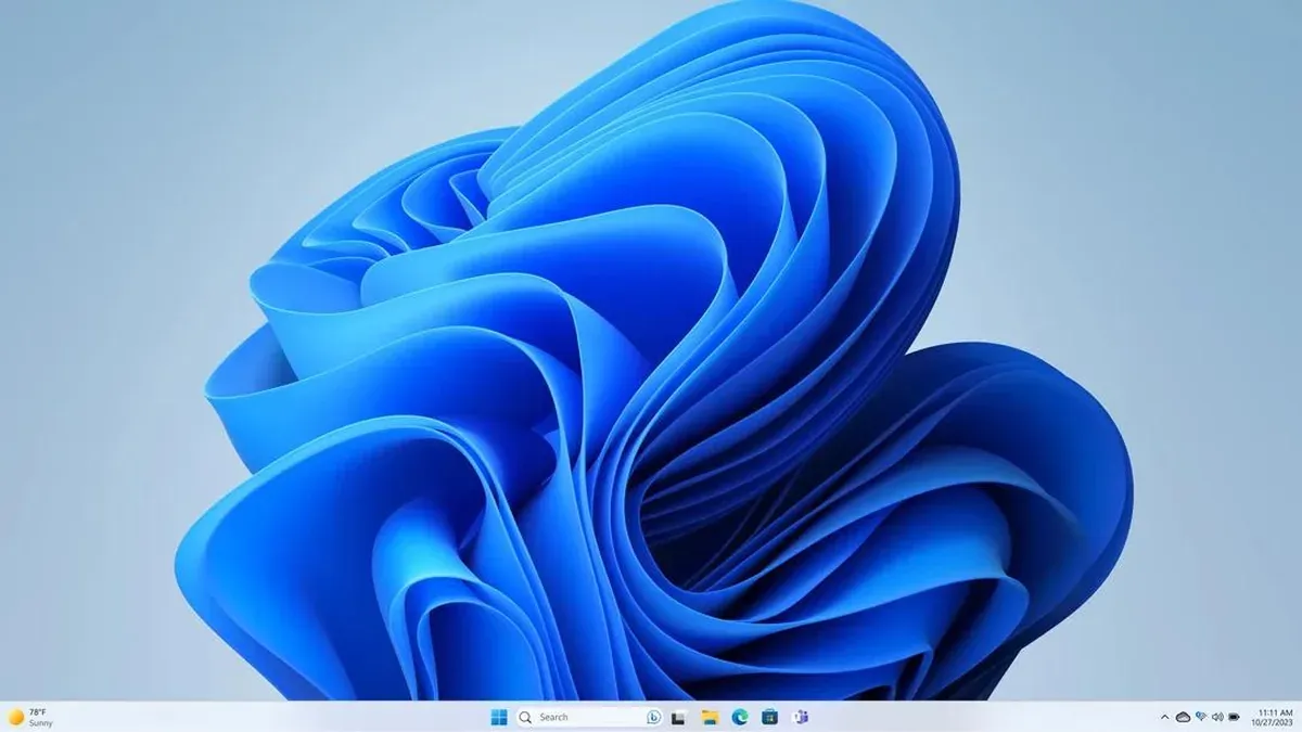 Windows 11 desktop featuring Microsoft's blue wallpaper and taskbar, accompanying news of the October 2026 Patch Tuesday security update