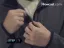 Person zipping up a jacket.