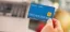 Credit card being held in hand.